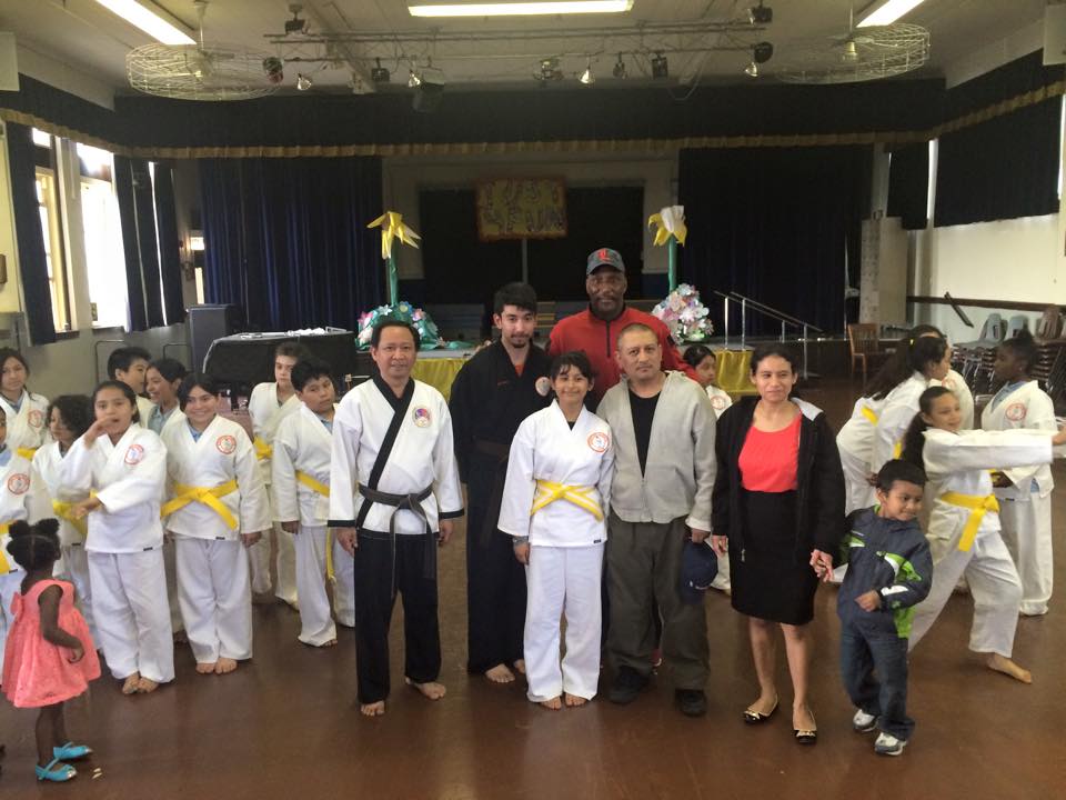 A group of people are posing for a picture in a room.