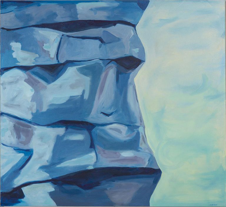 An oil painting of a blue stone Moai statue head against a soft, pale blue background.