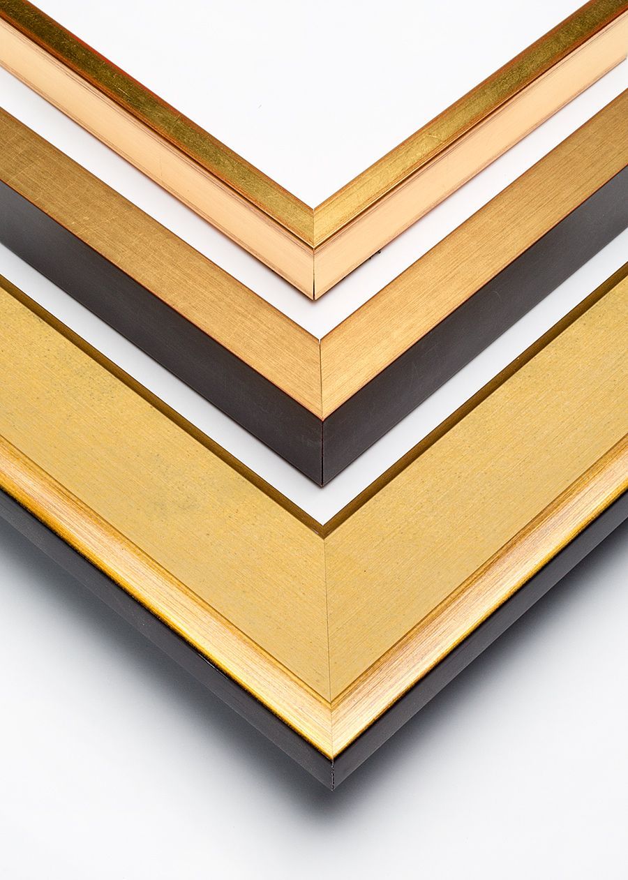 Three nested picture frame corners, featuring metallic gold finishes with black or light-toned wooden sides.