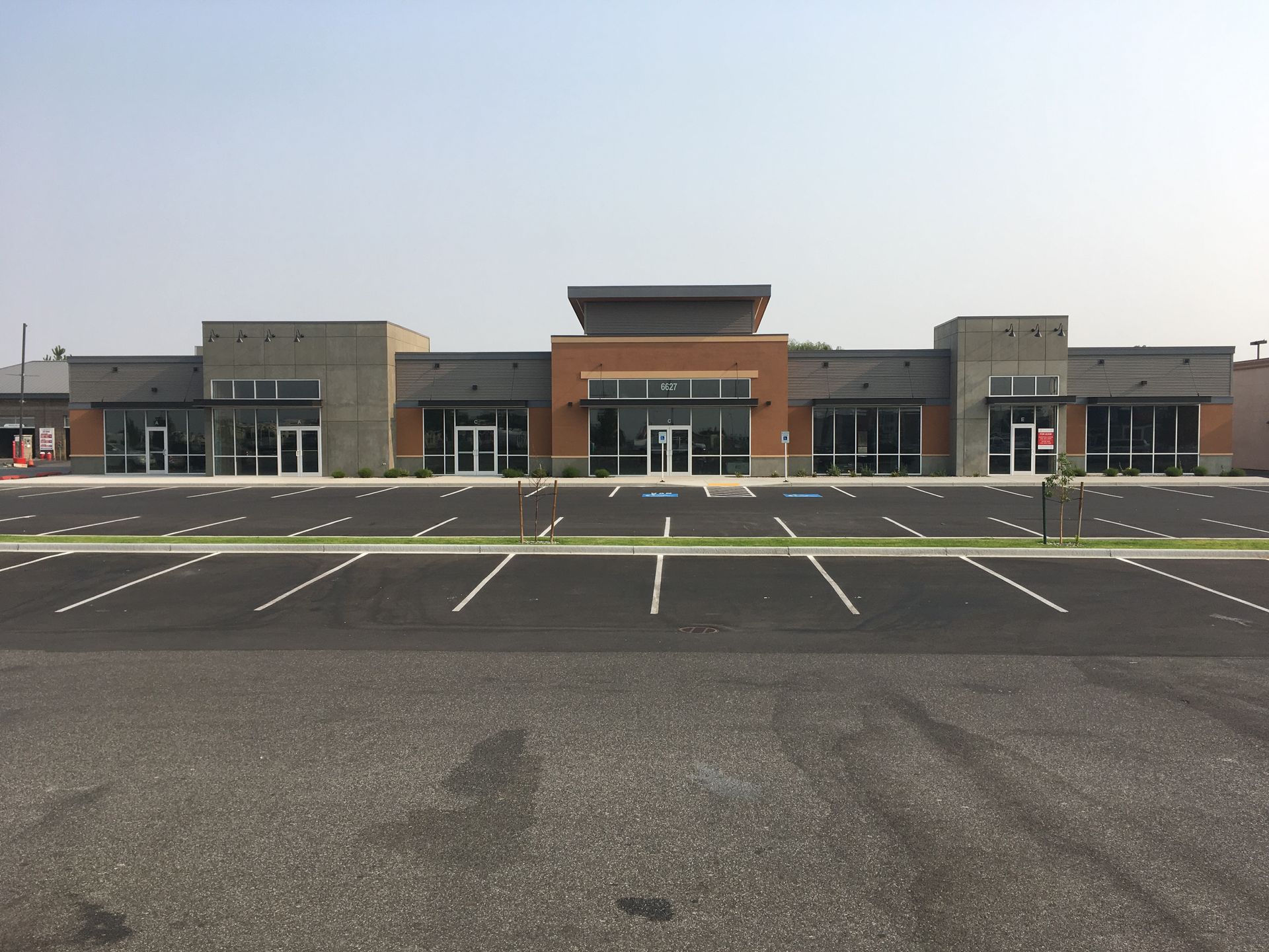 A large building with a parking lot in front of it