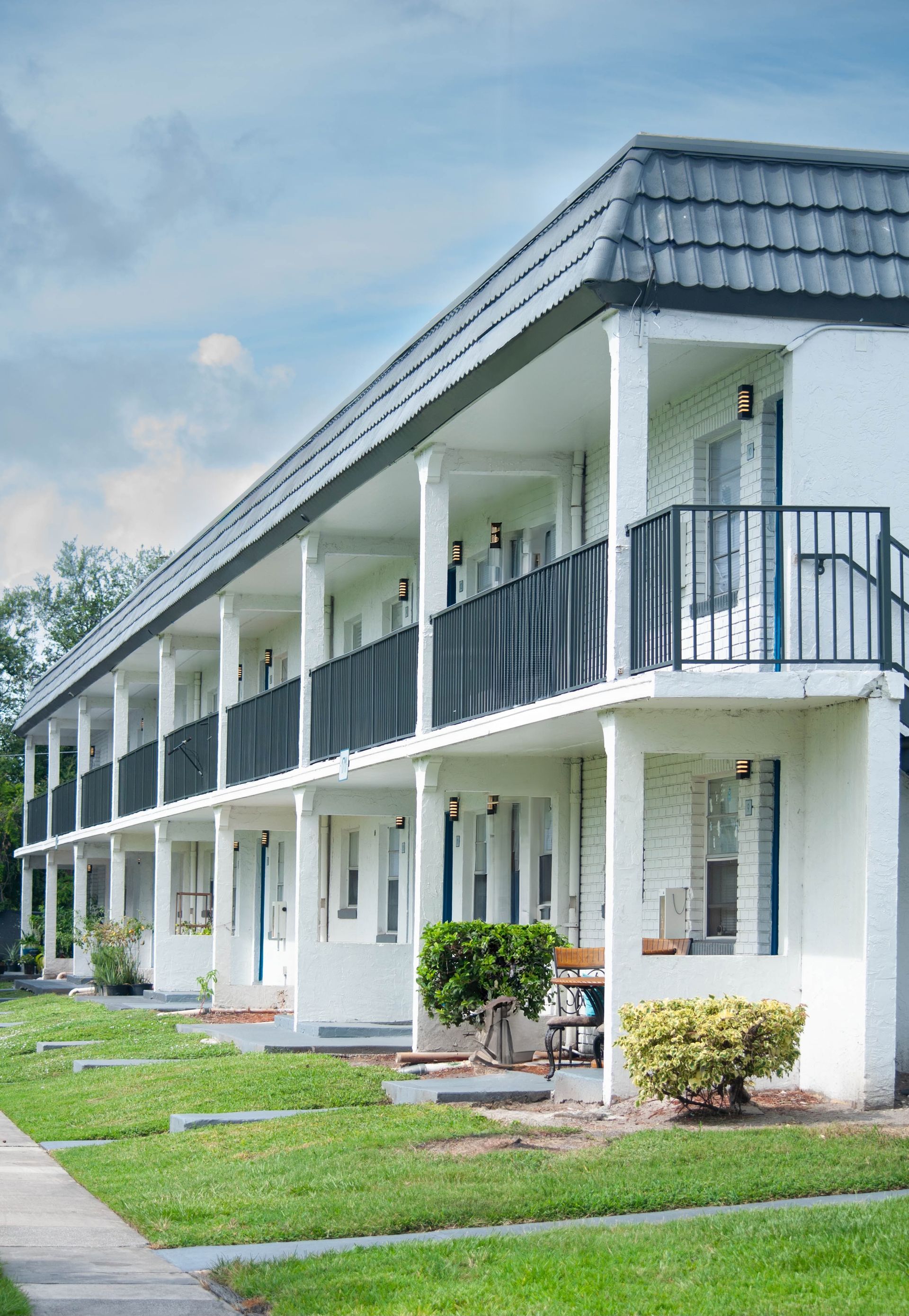 A large white building with a lot of windows and balconies.