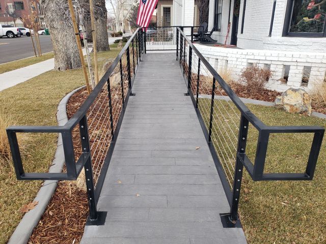 A Ramp with a Black Railing Leading to a House – Reno, NV – Concreteworks LLC