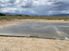 A Large Concrete Slab is Sitting in the Middle of a Dirt Field – Reno, NV – Concreteworks LLC