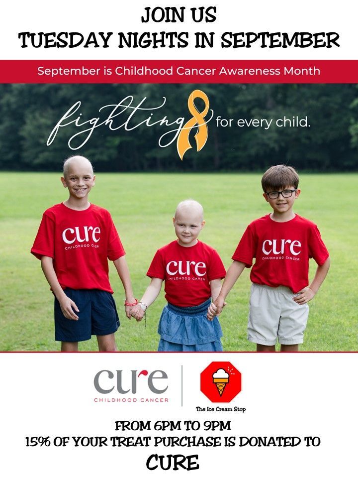 A child is wearing boxing gloves and a red shirt that says cure