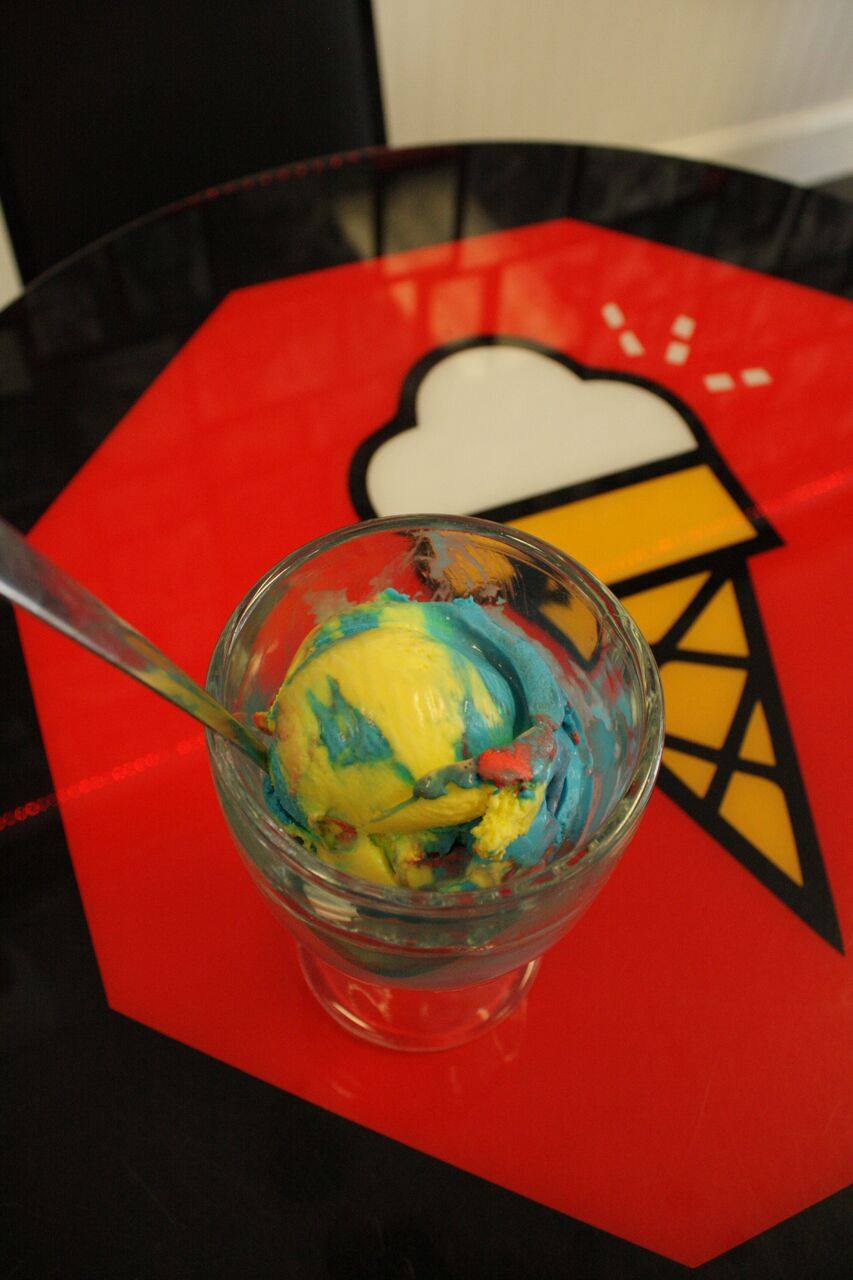 A glass of ice cream with a spoon in it