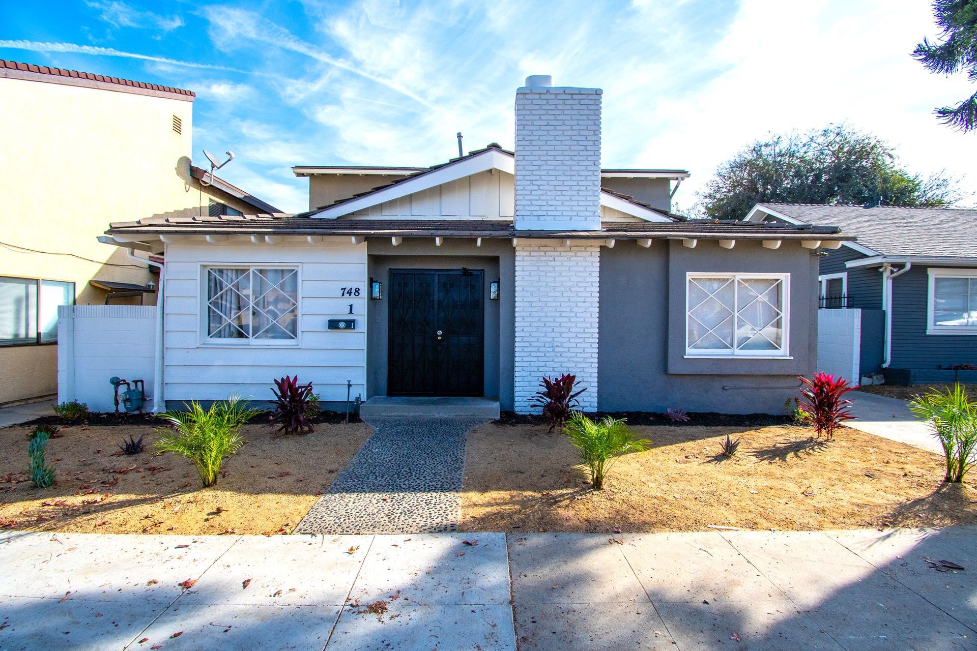 A house with a chimney on the top of it