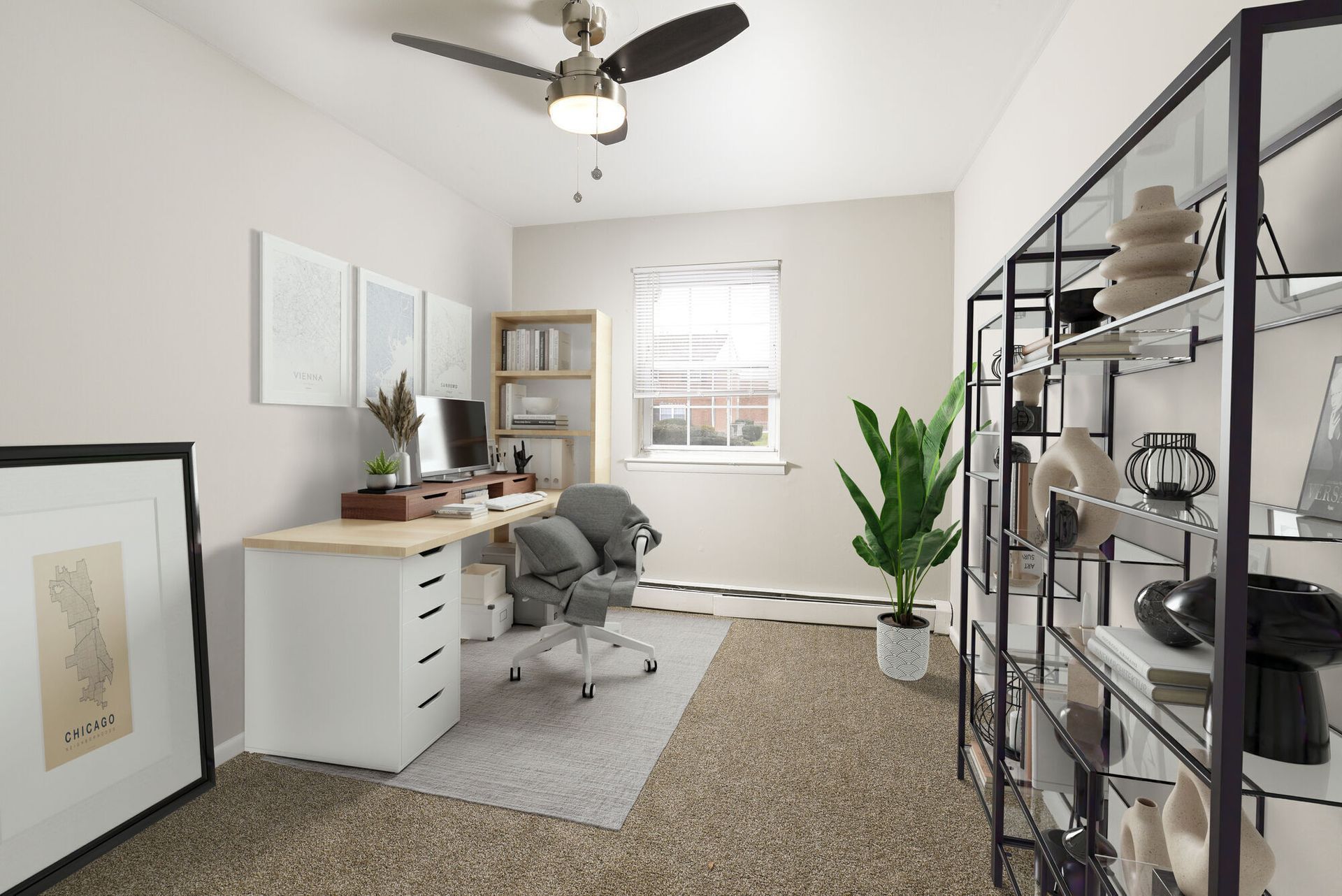 Bright home office with a white desk, chair, shelving, and a tall plant.