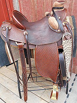 Brown leather Western saddle on display.
