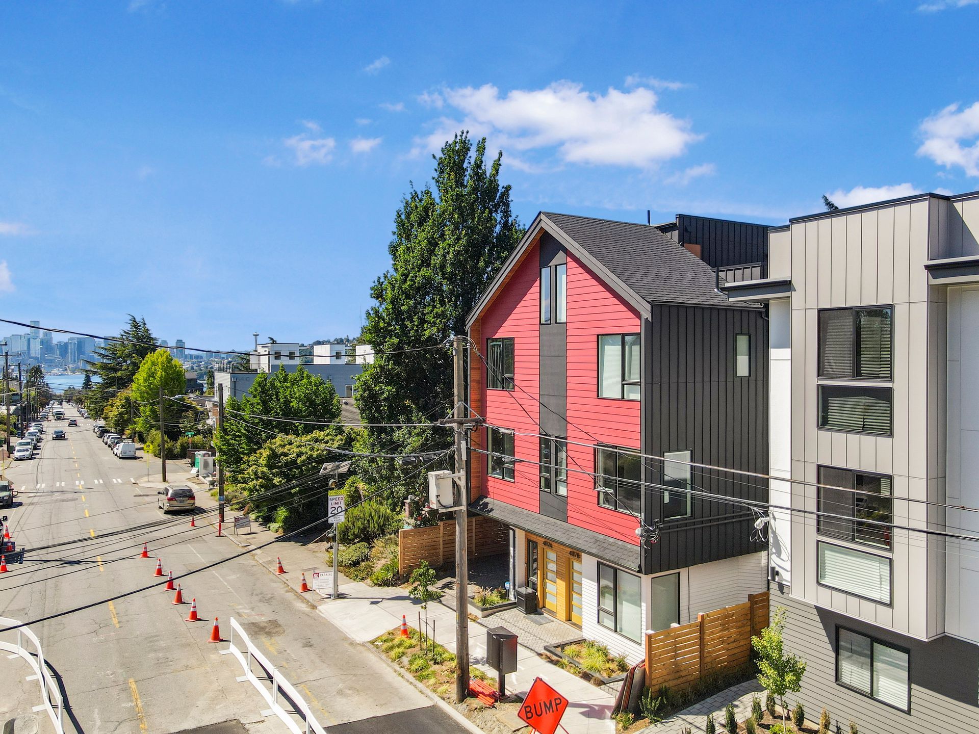 An aerial view of a row of houses on a city street.