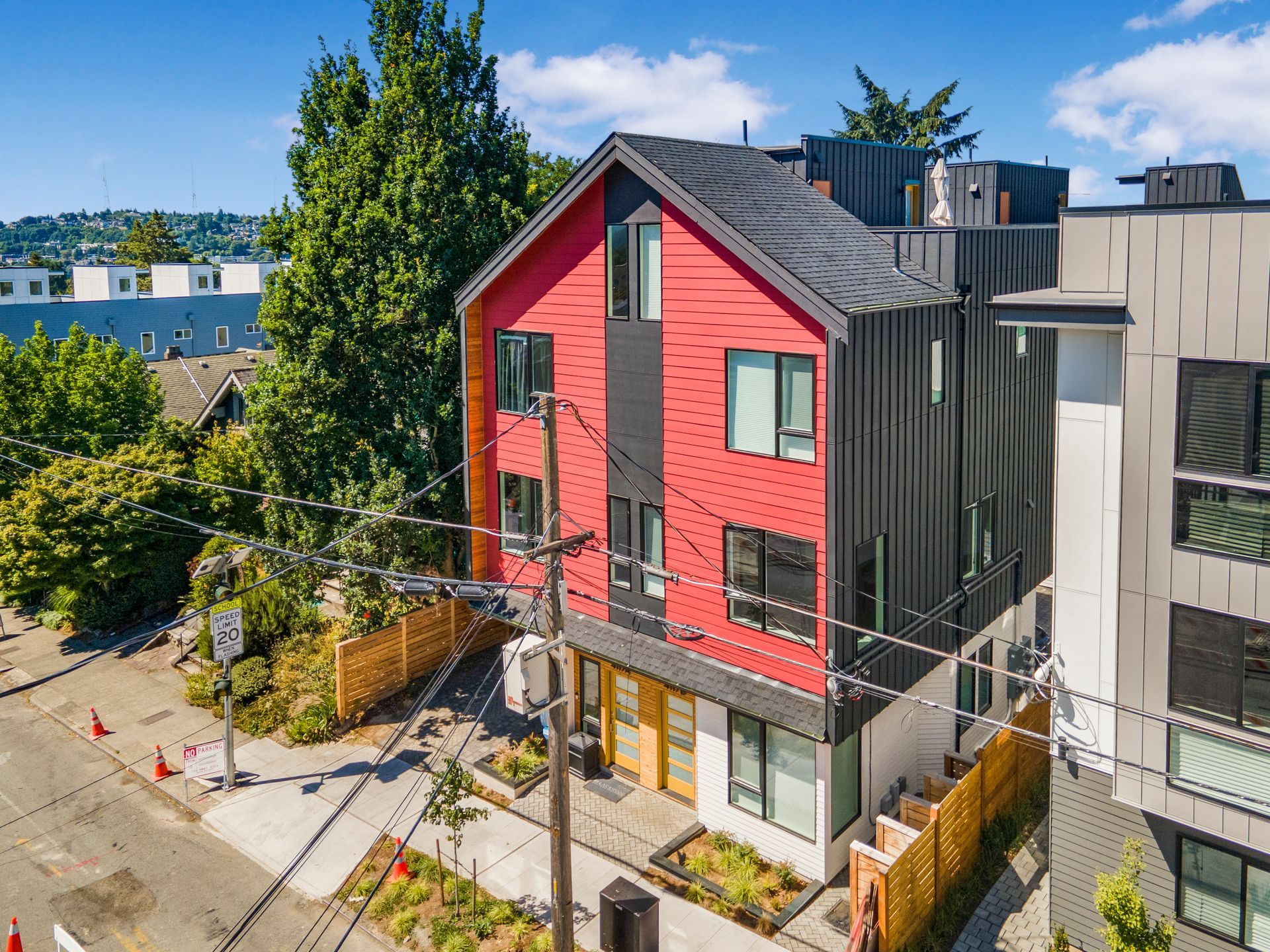 An aerial view of a red and black apartment building
