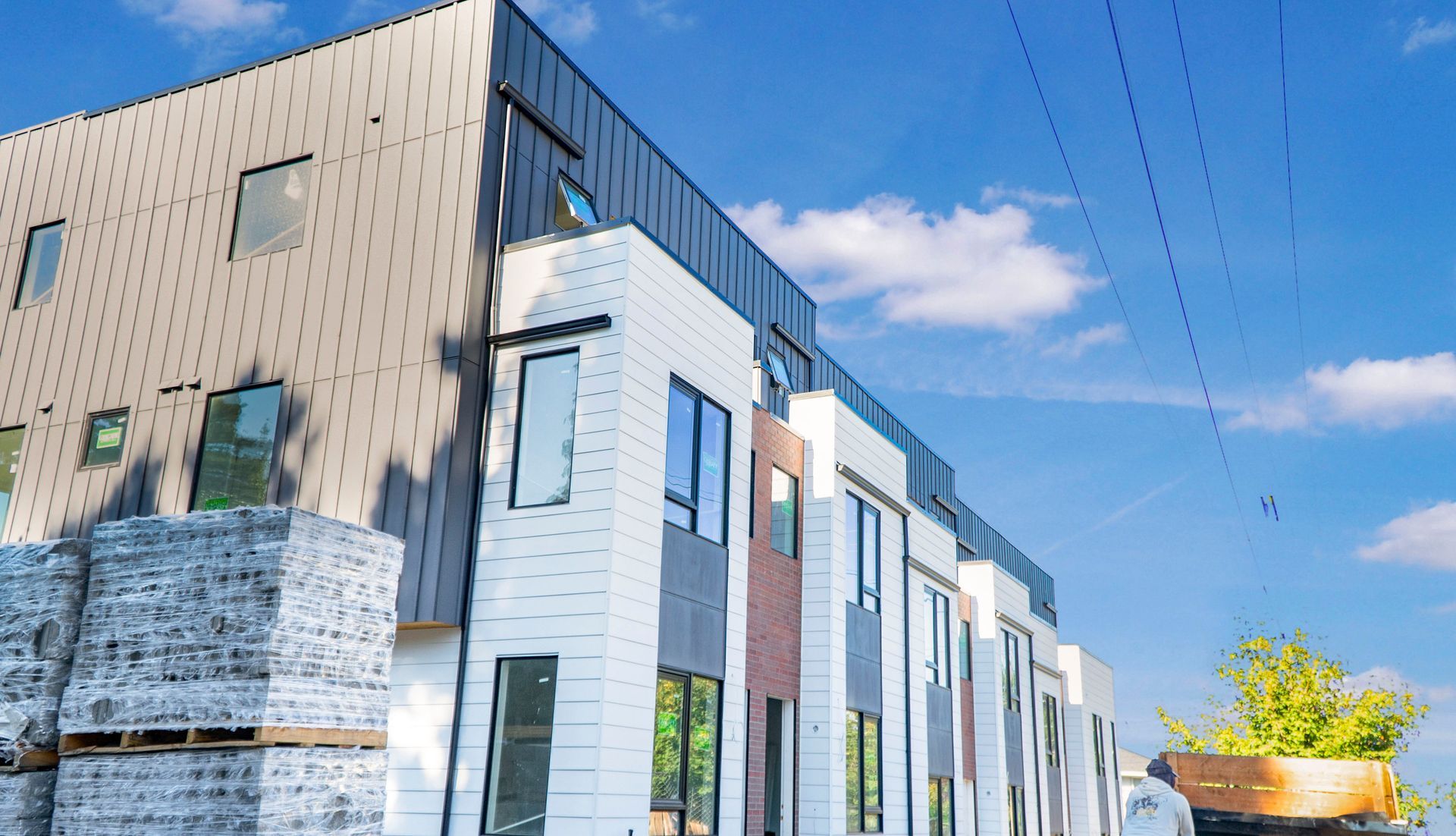 A large building with a lot of windows is being built.