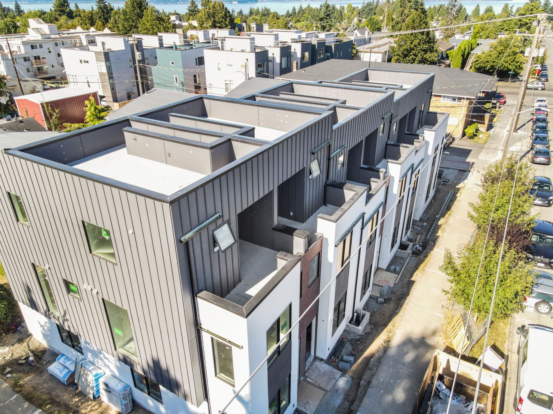 An aerial view of a building under construction in a city.