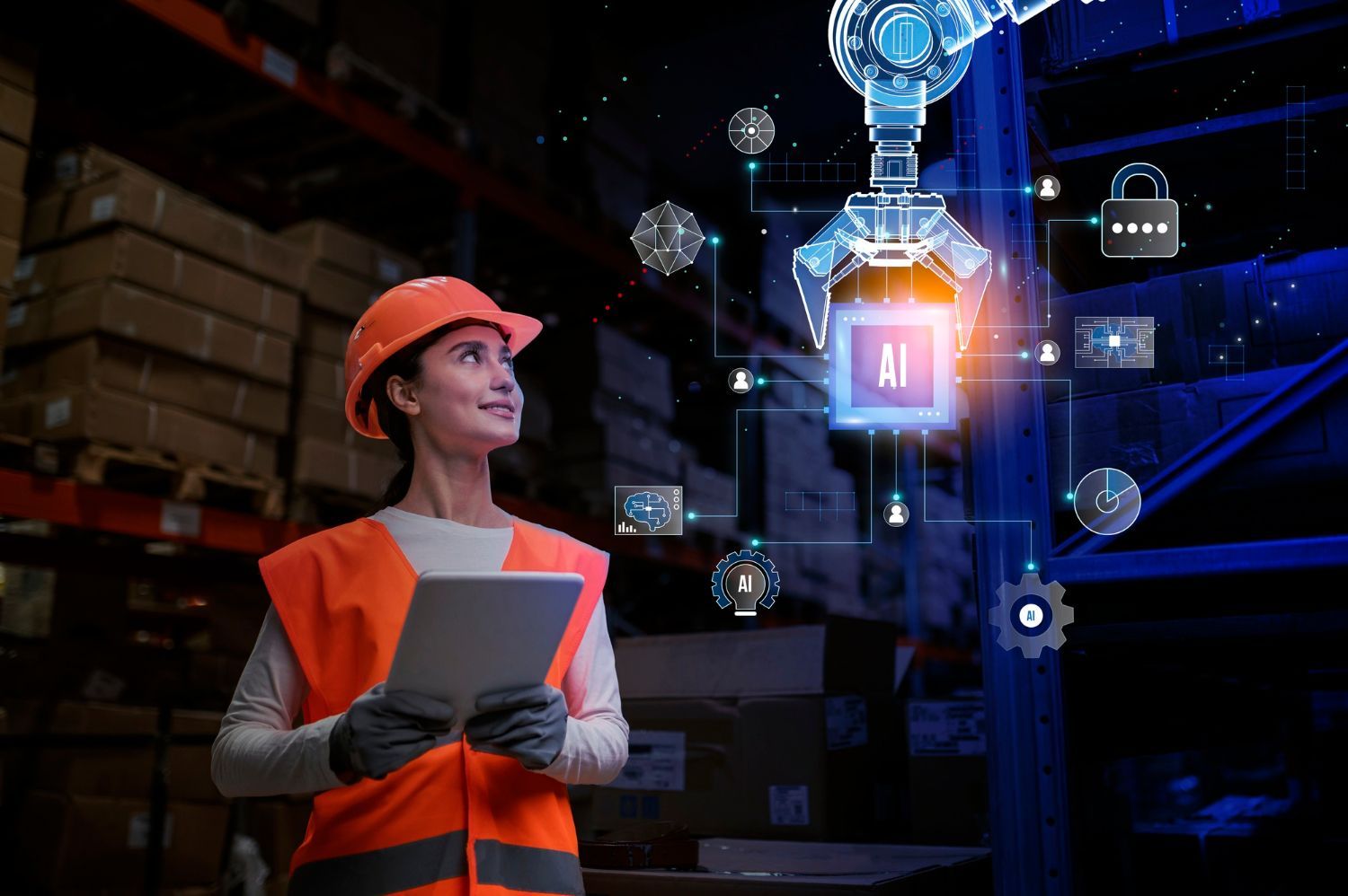 A woman in a hard hat is holding a tablet in a warehouse.