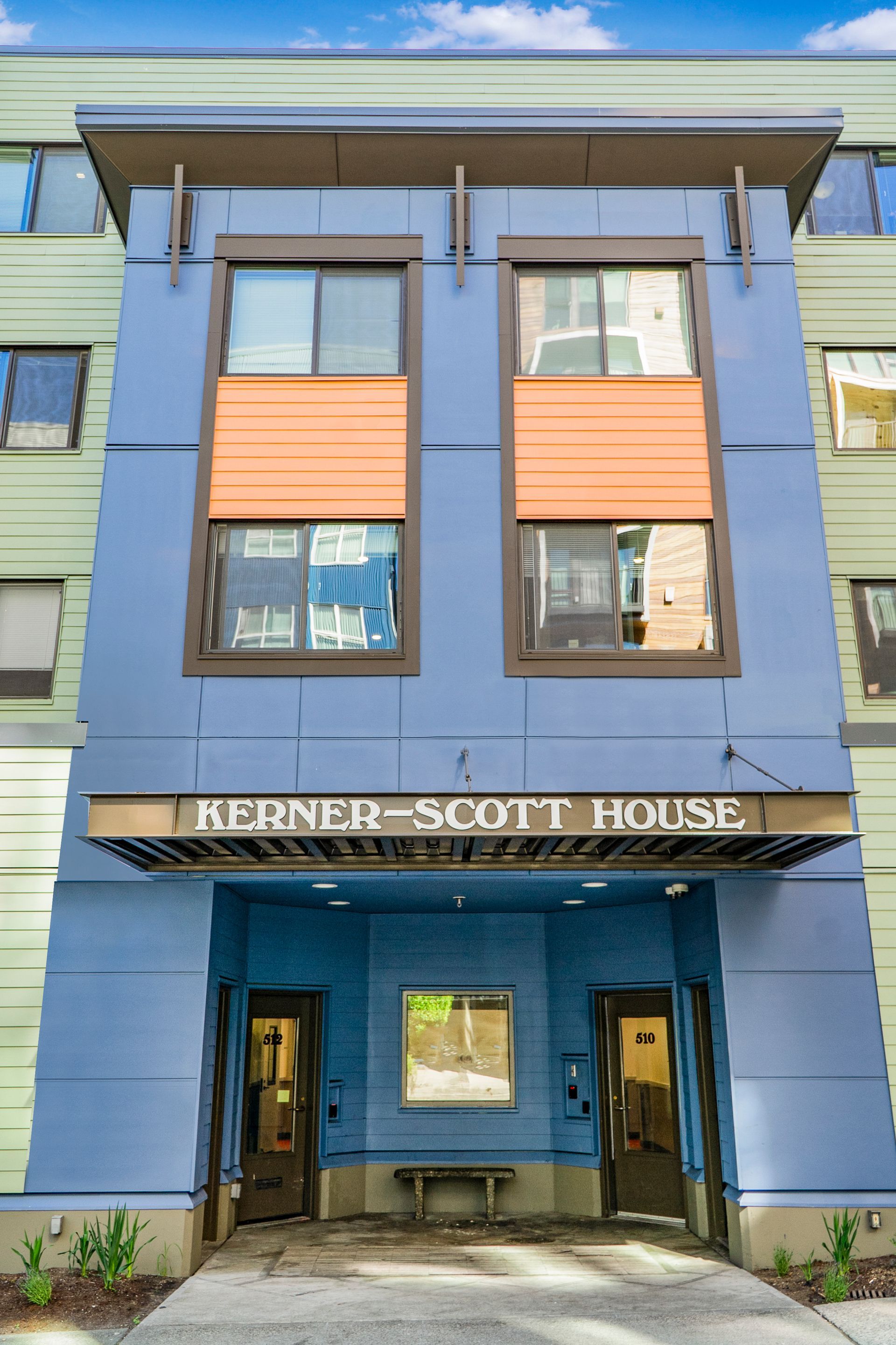 A blue building with a sign that says kerner scott house