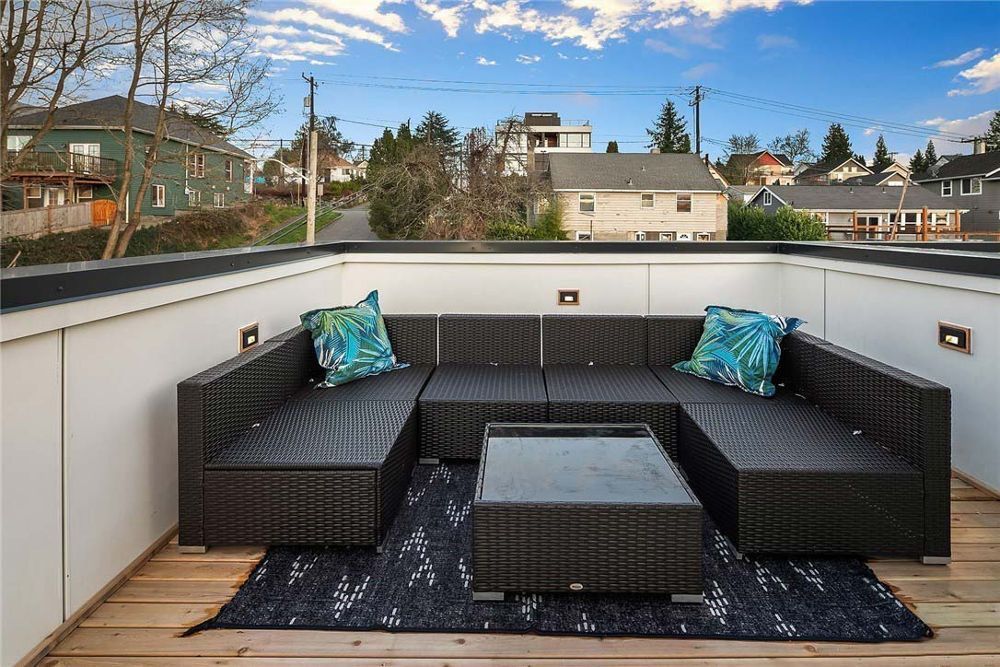 A patio with a couch and a table on it