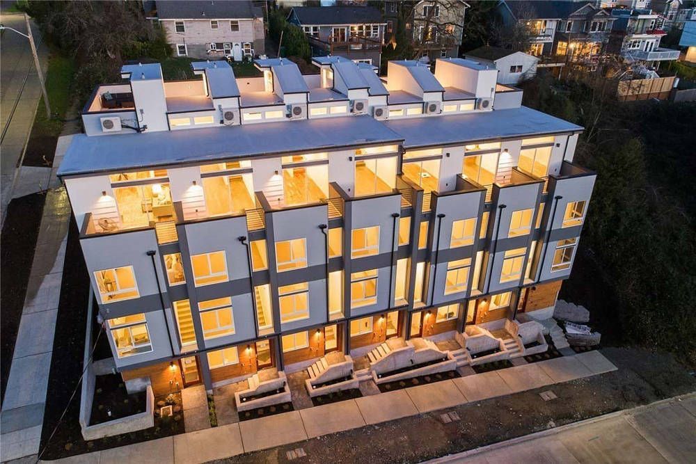 An aerial view of a building with lots of windows at night