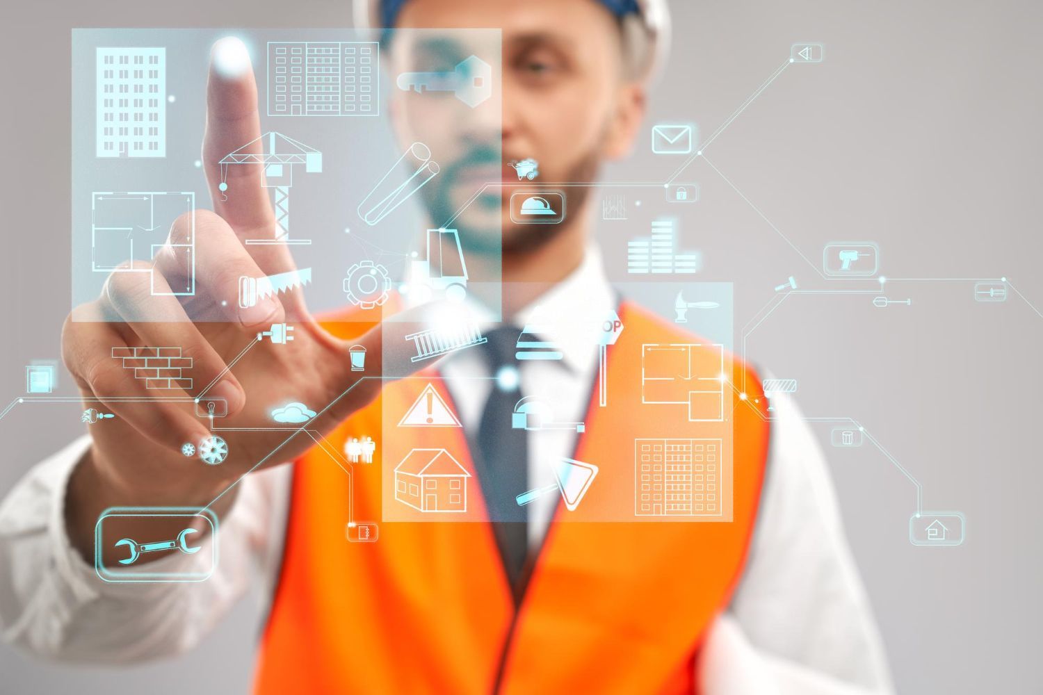 A construction worker is pressing a button on a virtual screen.