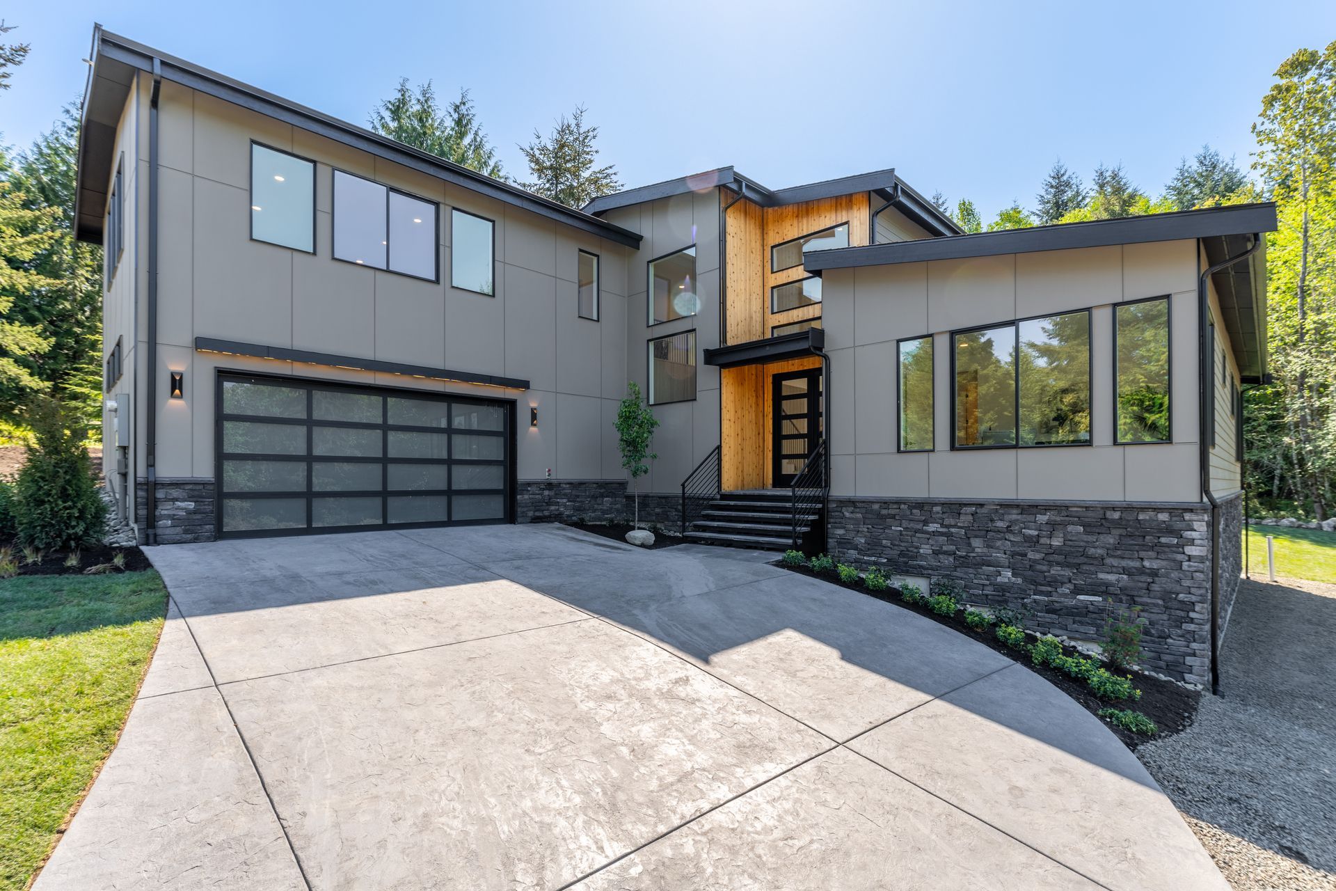 A large house with a concrete driveway in front of it.