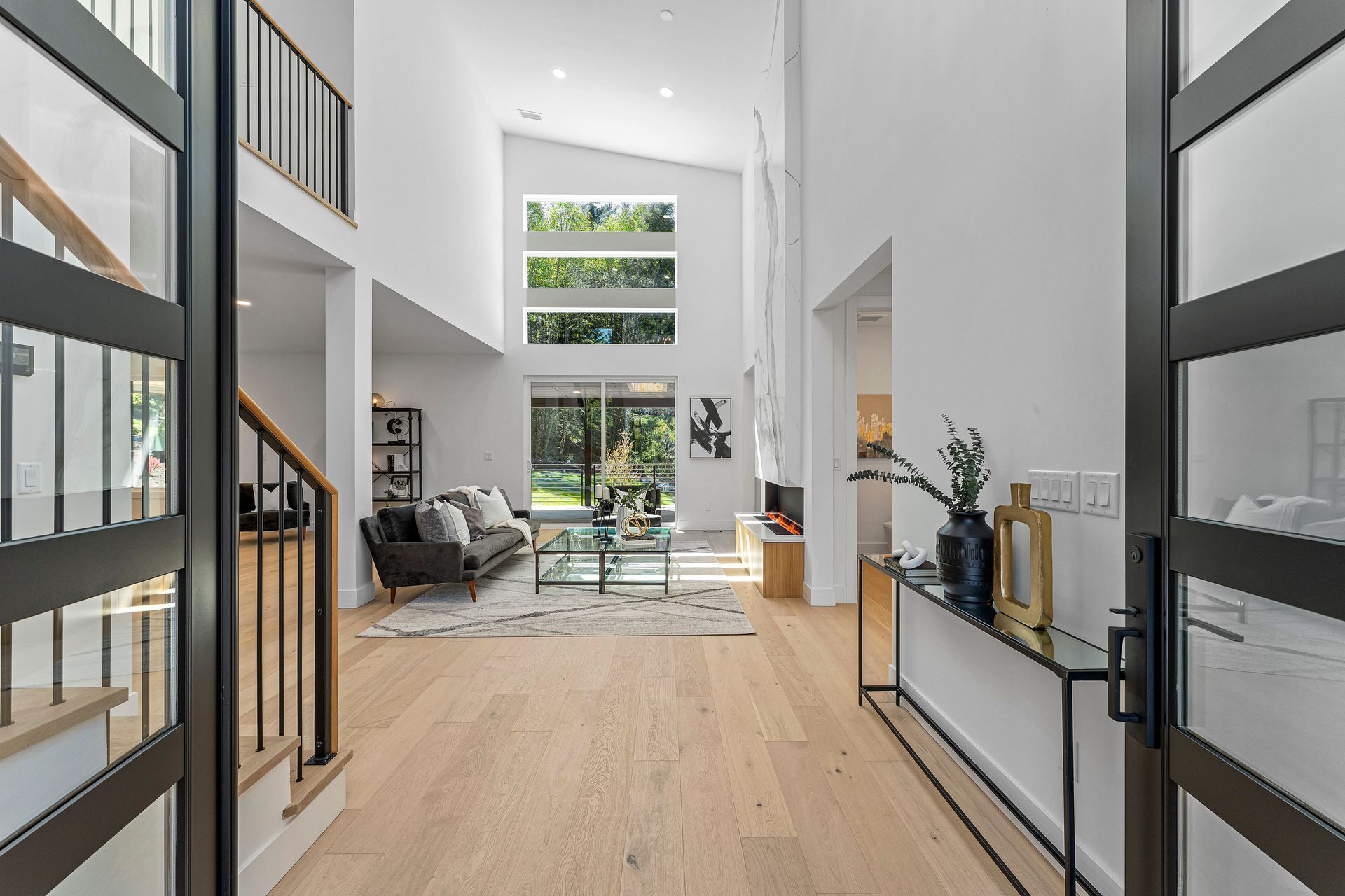 A view of a living room from the entrance of a house.