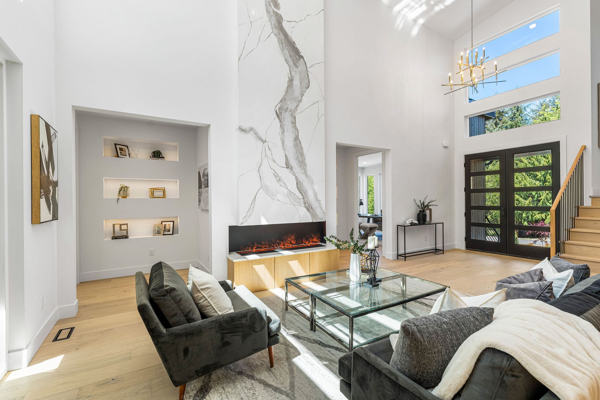 A living room filled with furniture and a fireplace.