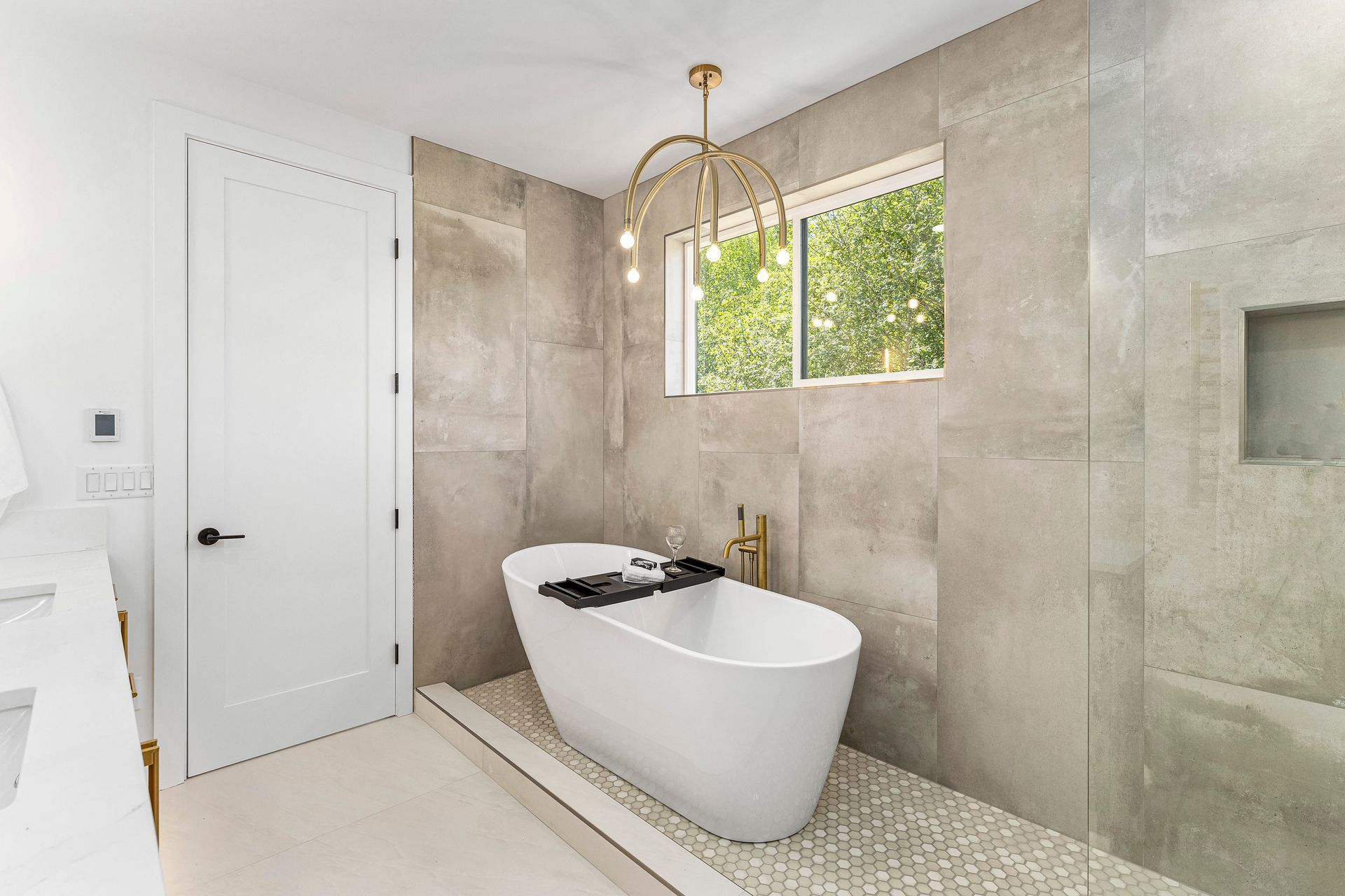 There is a bathtub in the middle of the bathroom.