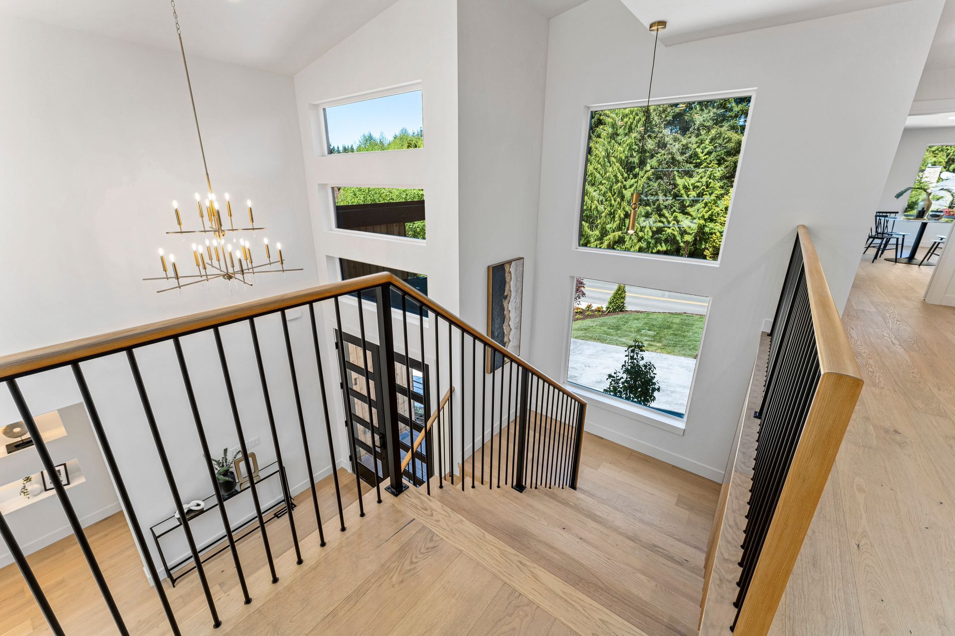 A view of a staircase from the second floor of a house.