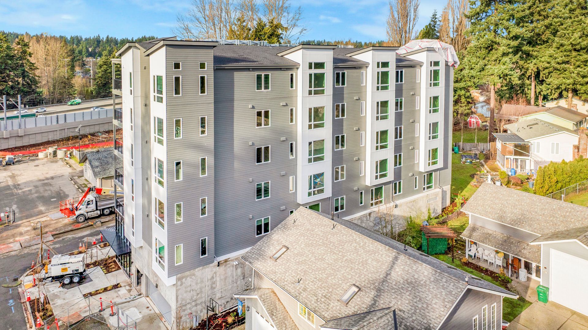 An aerial view of a large apartment building under construction.