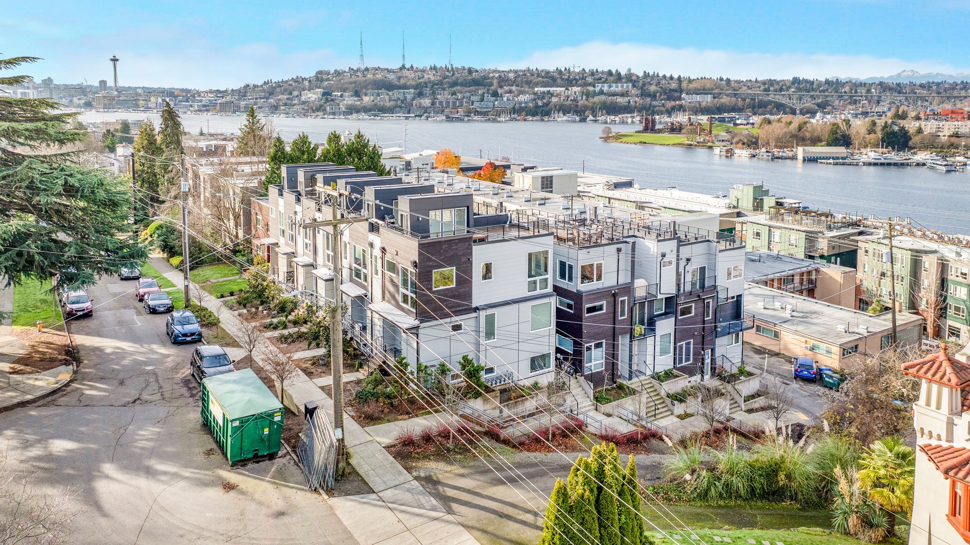 An aerial view of a city with a river in the background.