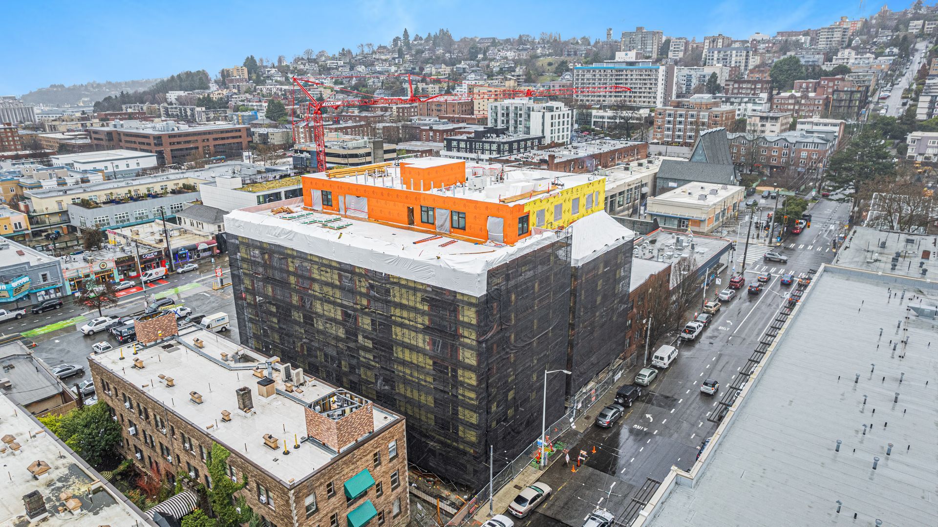 An aerial view of a large building in the middle of a city.