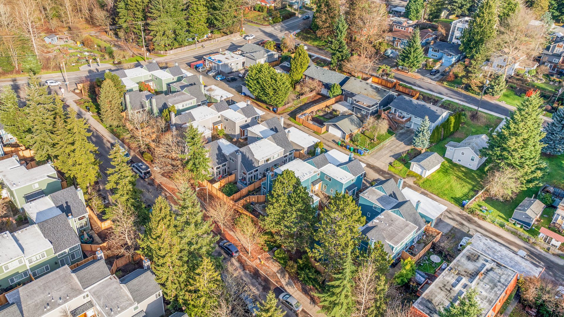 An aerial view of a residential neighborhood filled with lots of houses and trees.