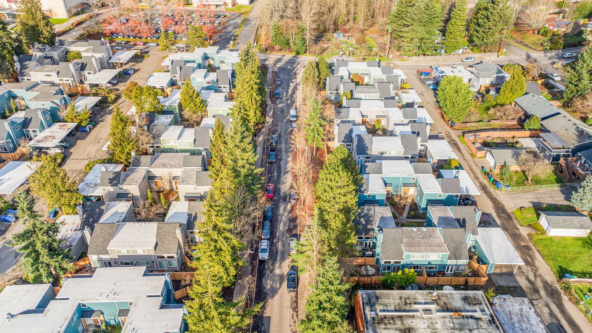 An aerial view of a residential area with lots of houses and trees.