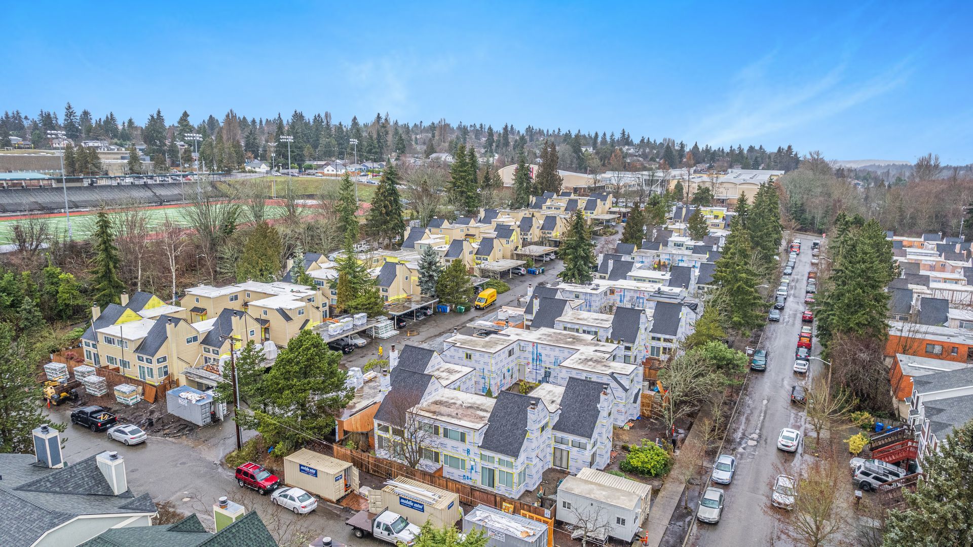 An aerial view of a residential area with lots of houses and trees.
