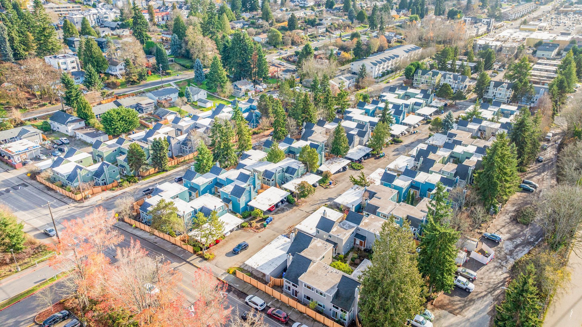 An aerial view of a residential area with lots of houses and trees.
