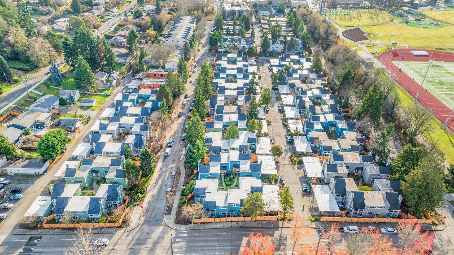 An aerial view of a residential area with lots of houses and trees.