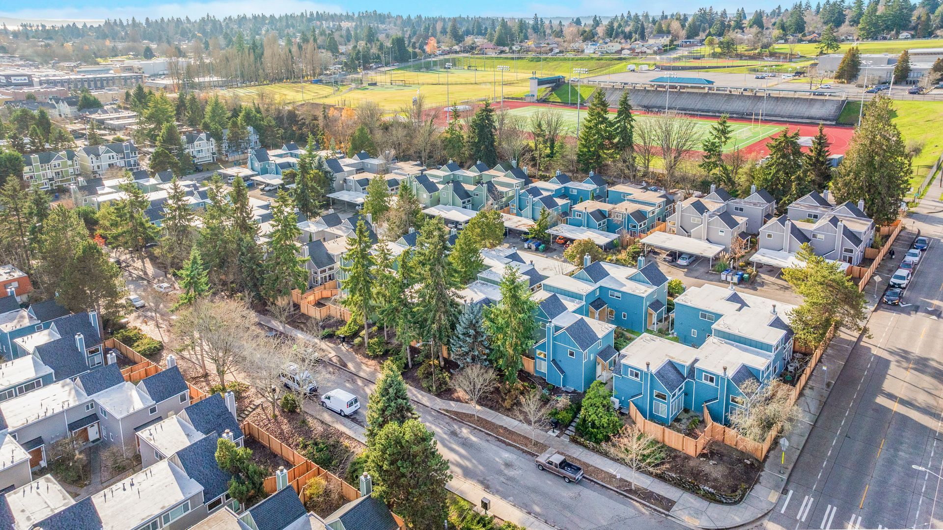 An aerial view of a residential area with lots of houses and trees.