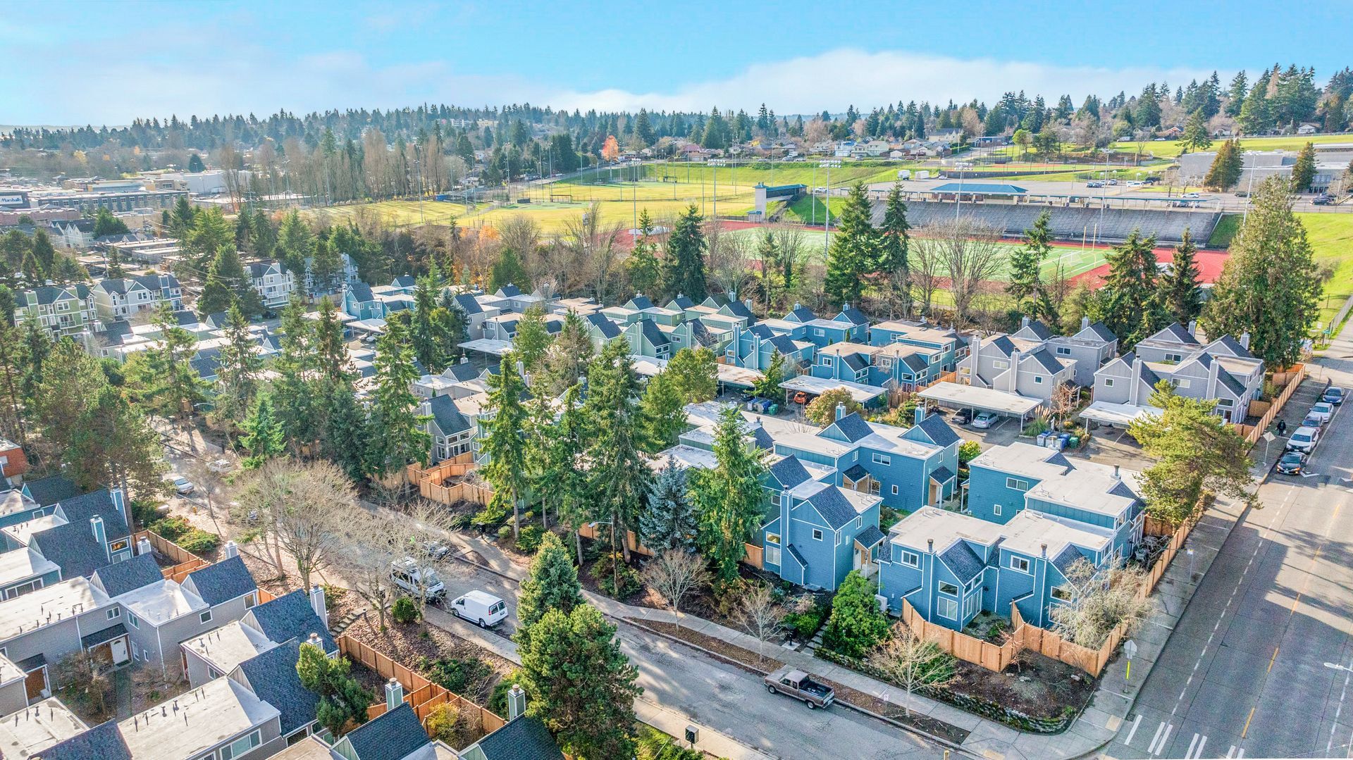 An aerial view of a residential area with lots of houses and trees.