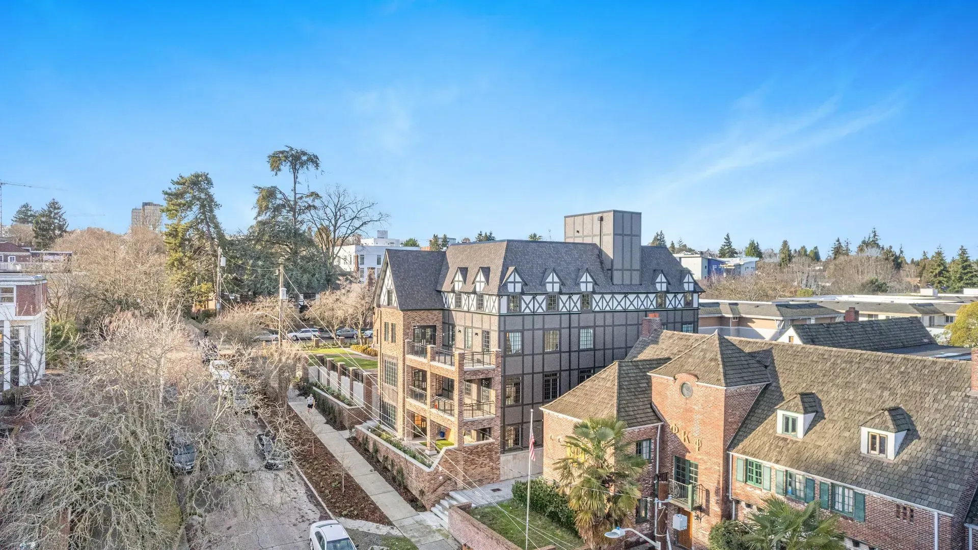 An aerial view of a large brick building surrounded by trees.
