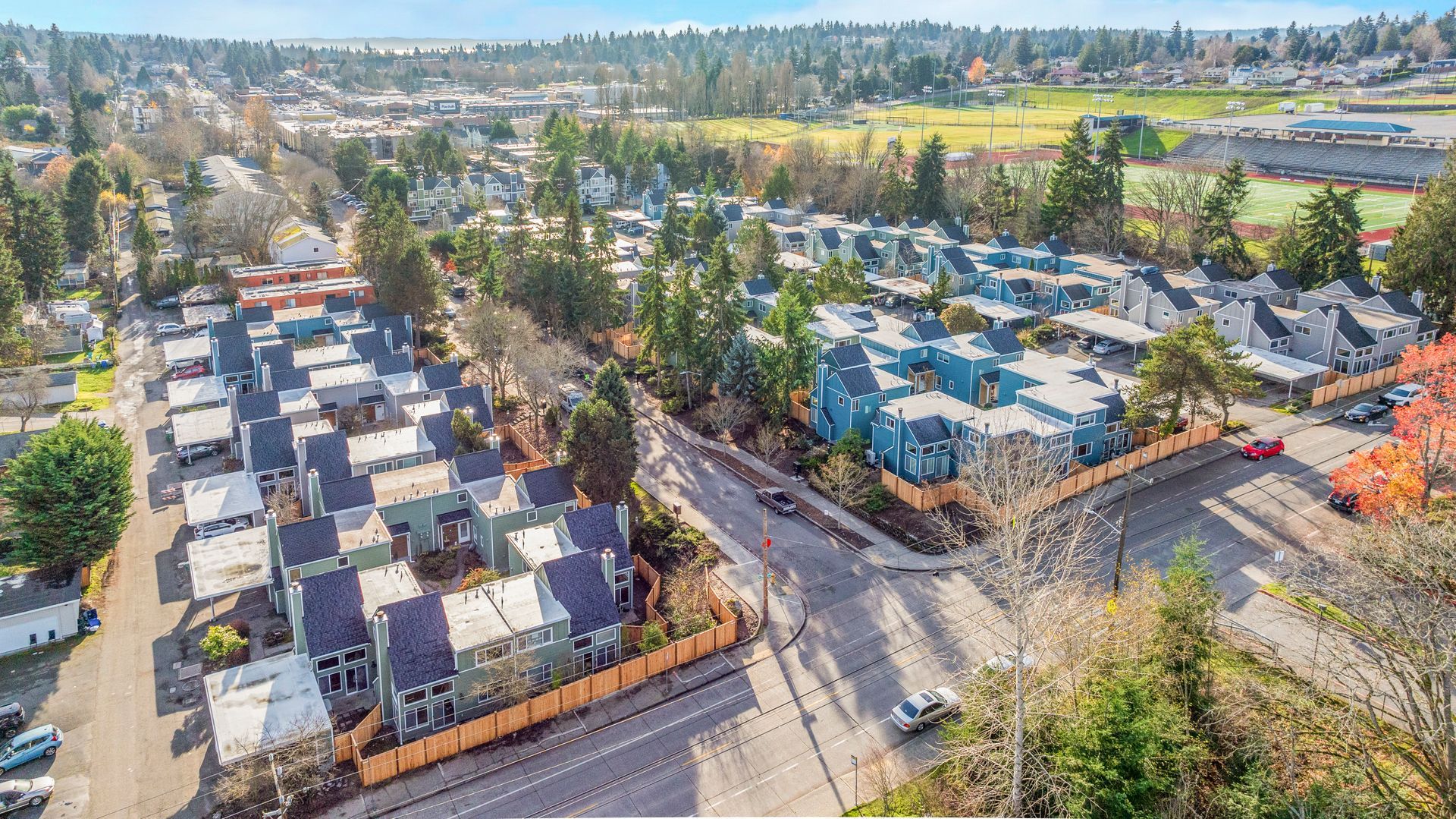 An aerial view of a residential area with lots of houses and trees.