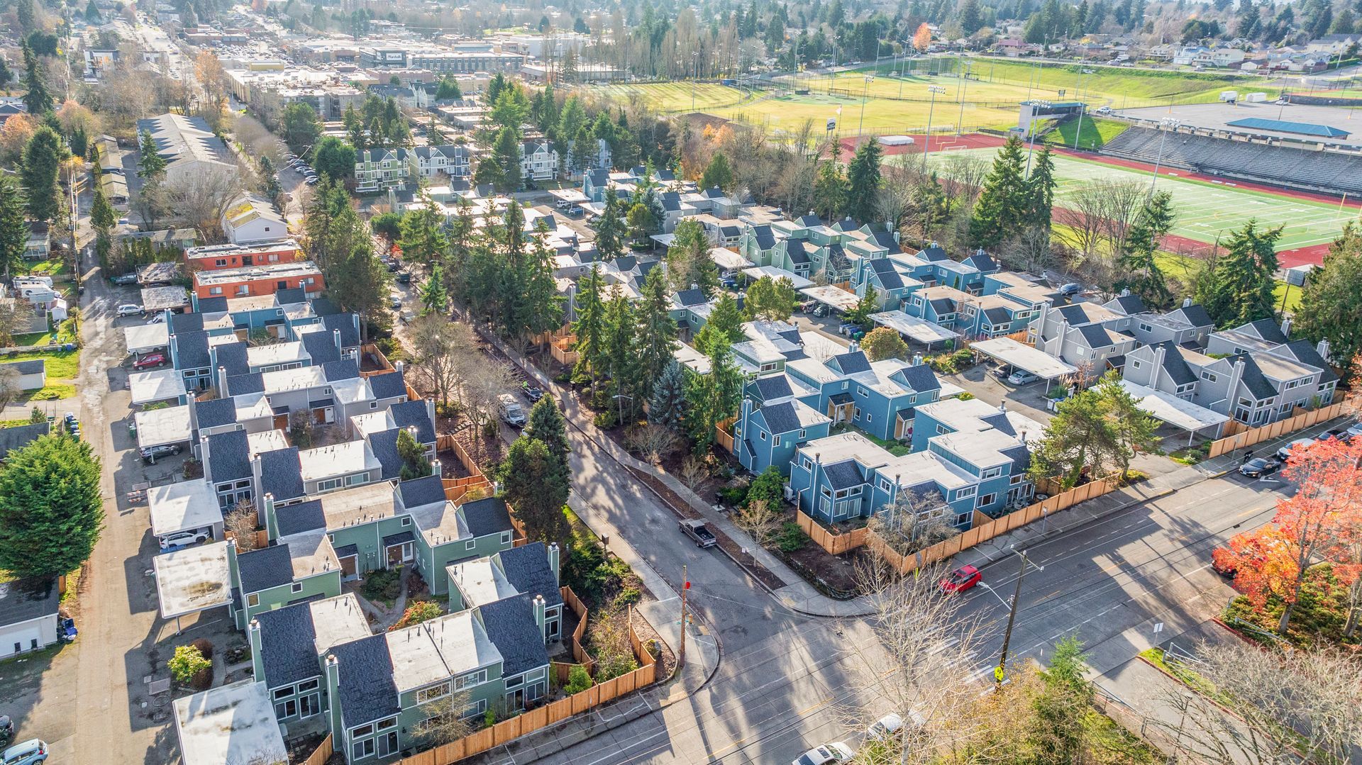 An aerial view of a residential area with lots of houses and trees.