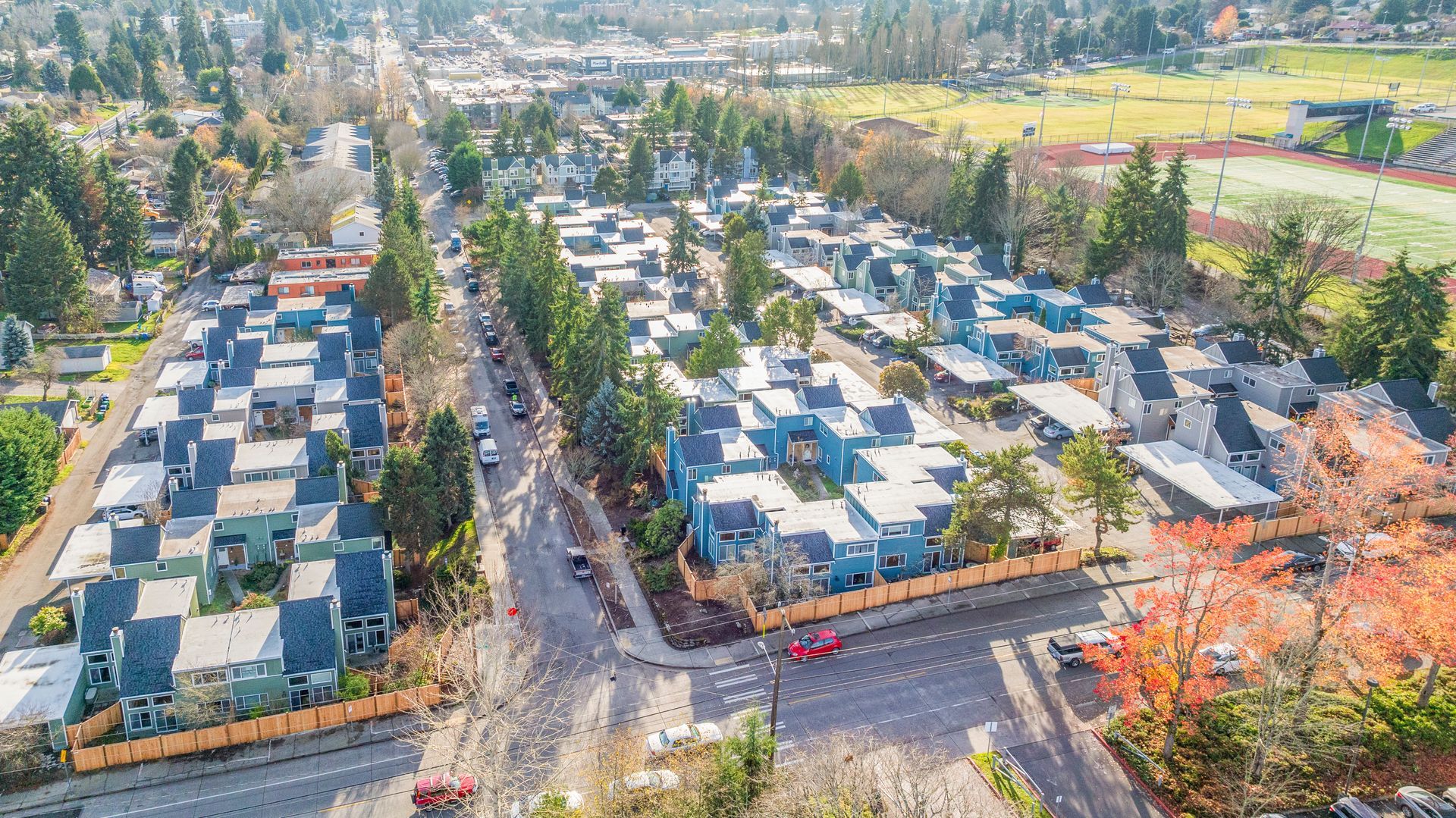 An aerial view of a residential area with lots of houses and trees.