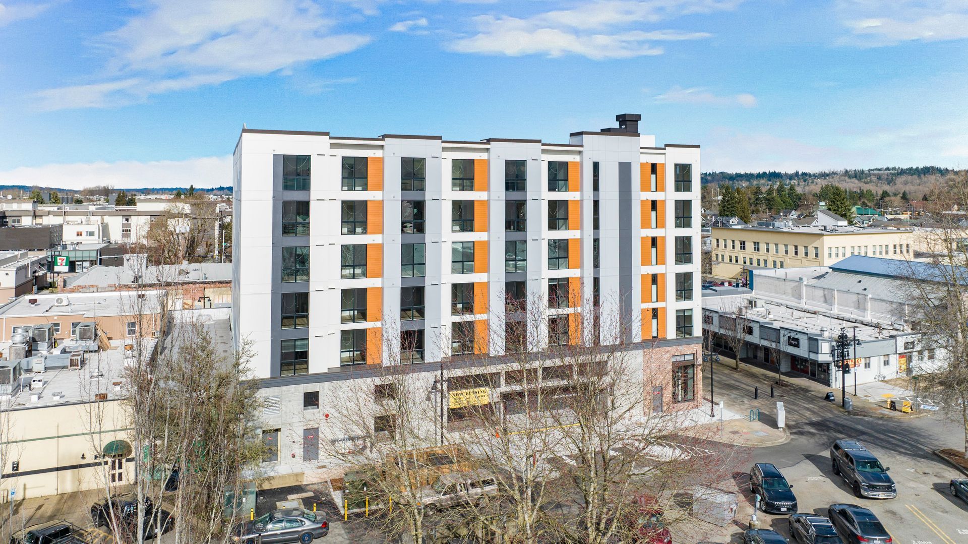 An aerial view of a building under construction in a city.