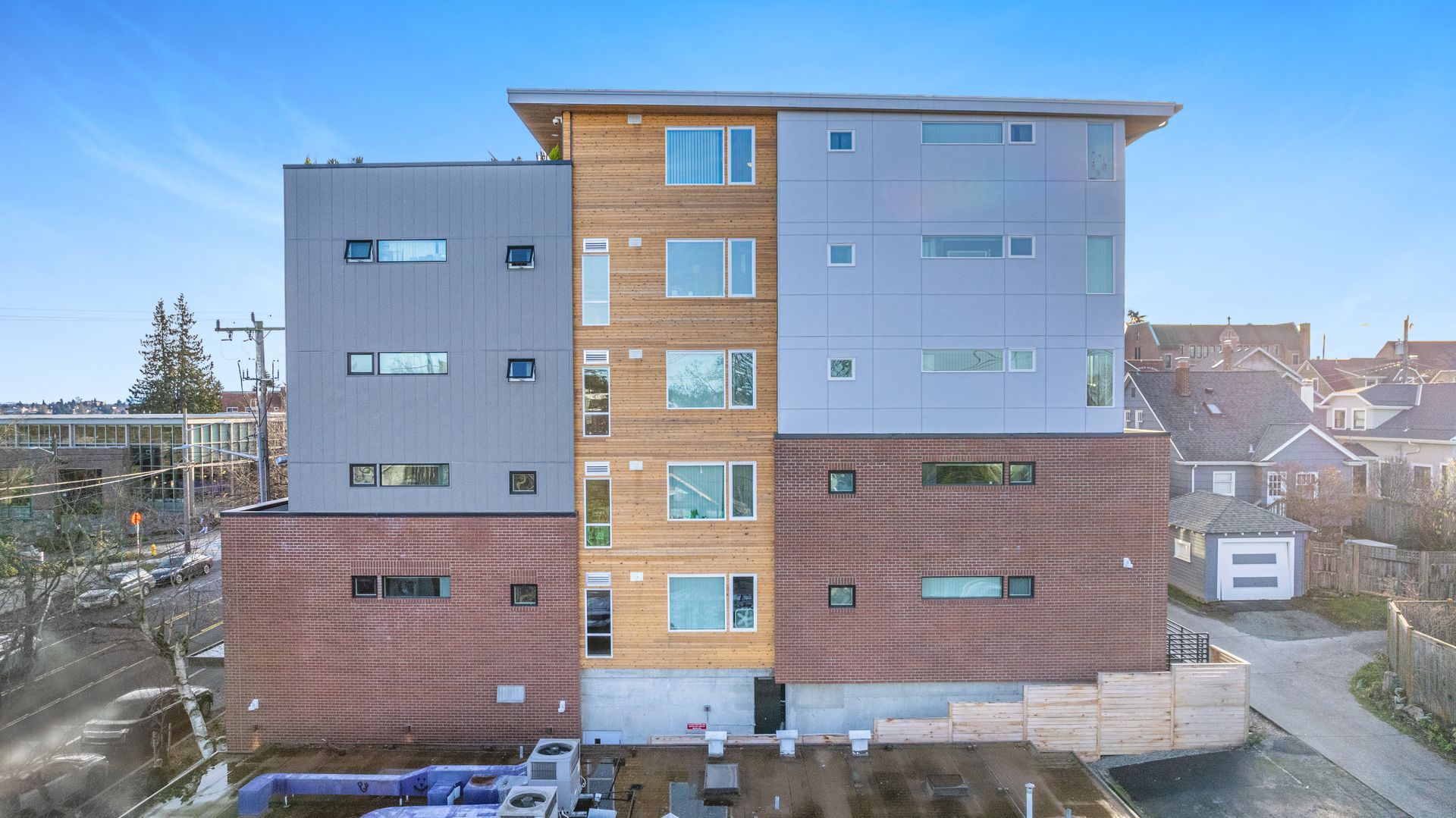 An aerial view of a large apartment building with a lot of windows.