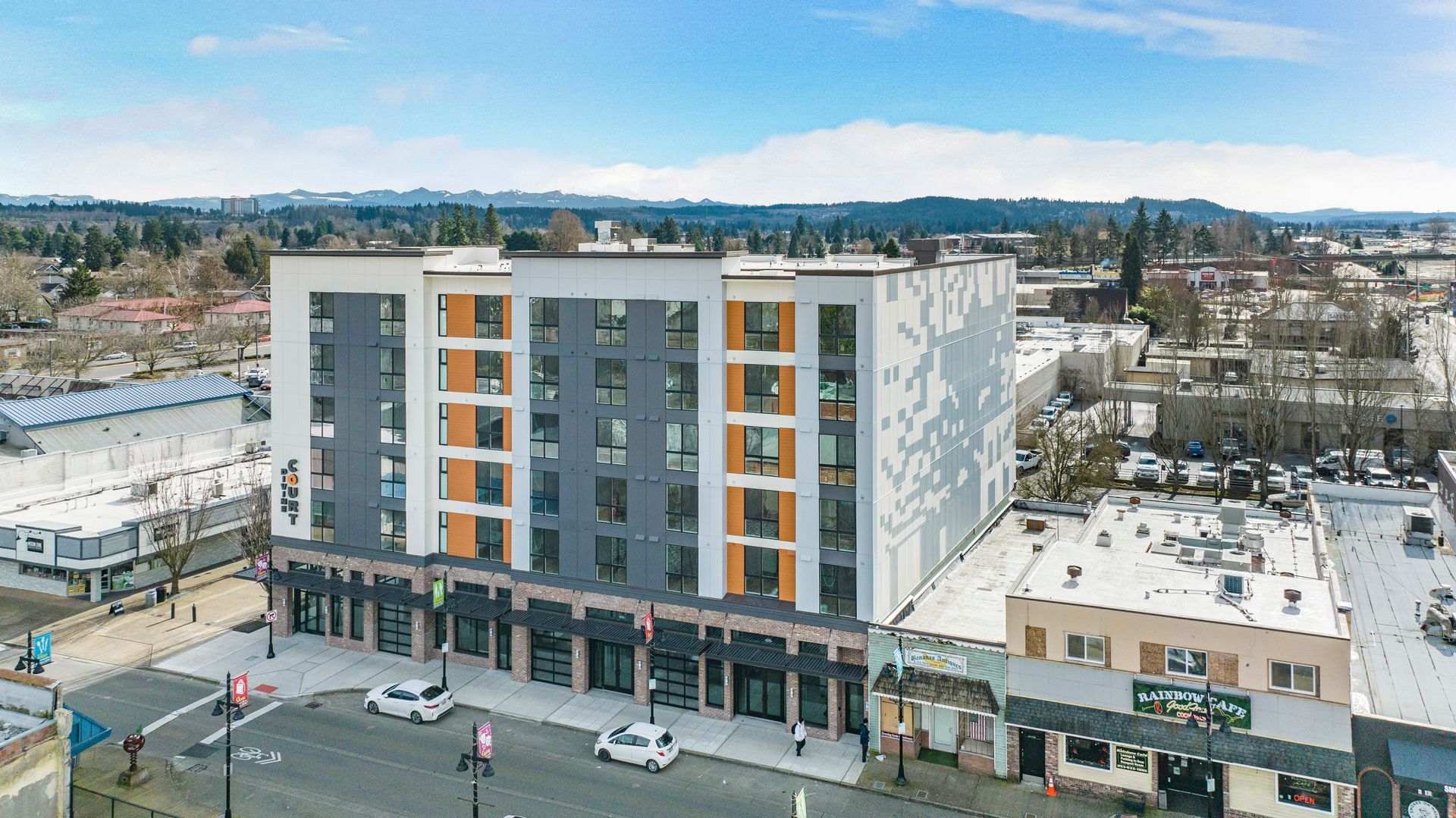 An aerial view of a large building in the middle of a city.