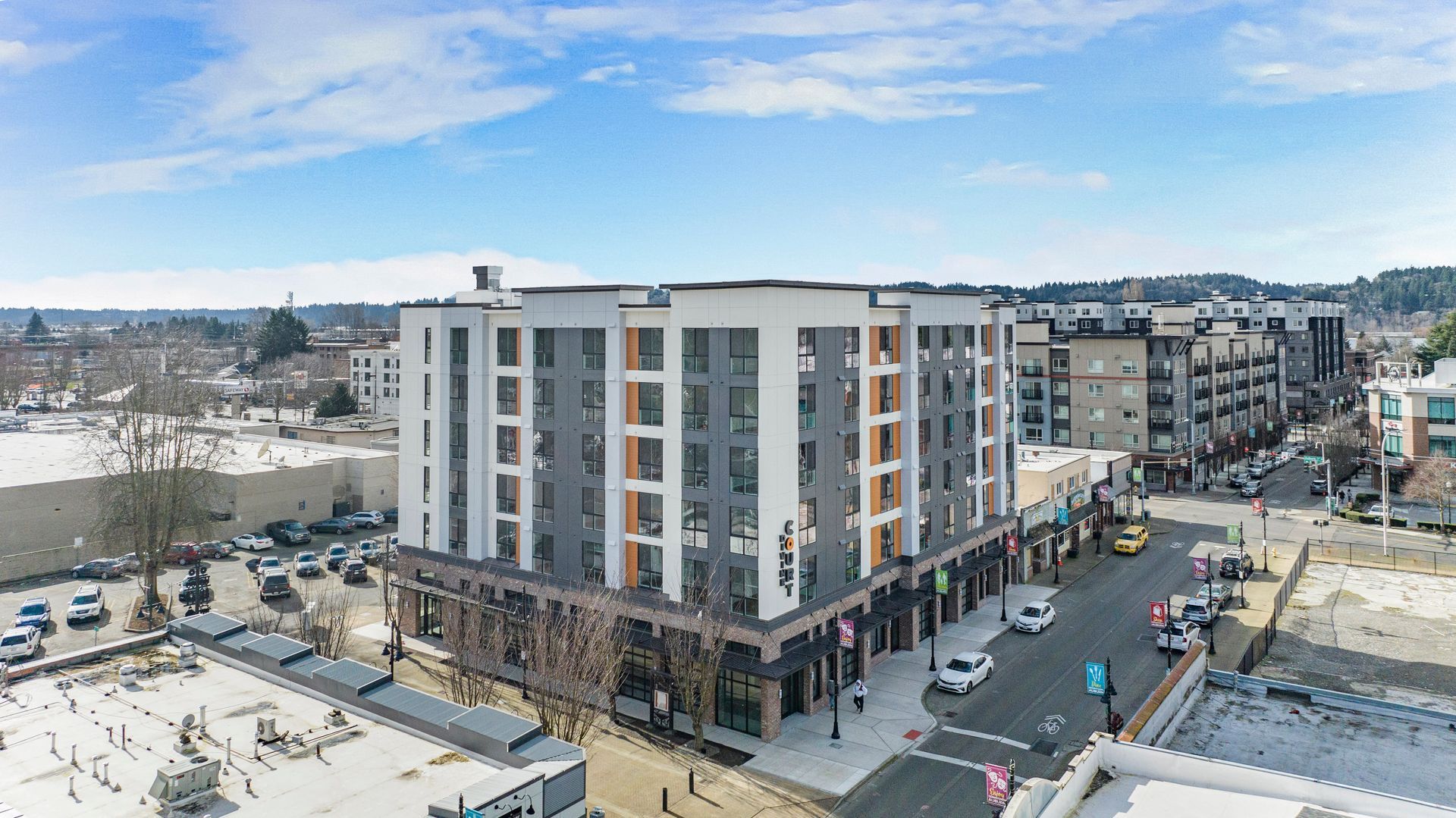 An aerial view of a large building in the middle of a city.