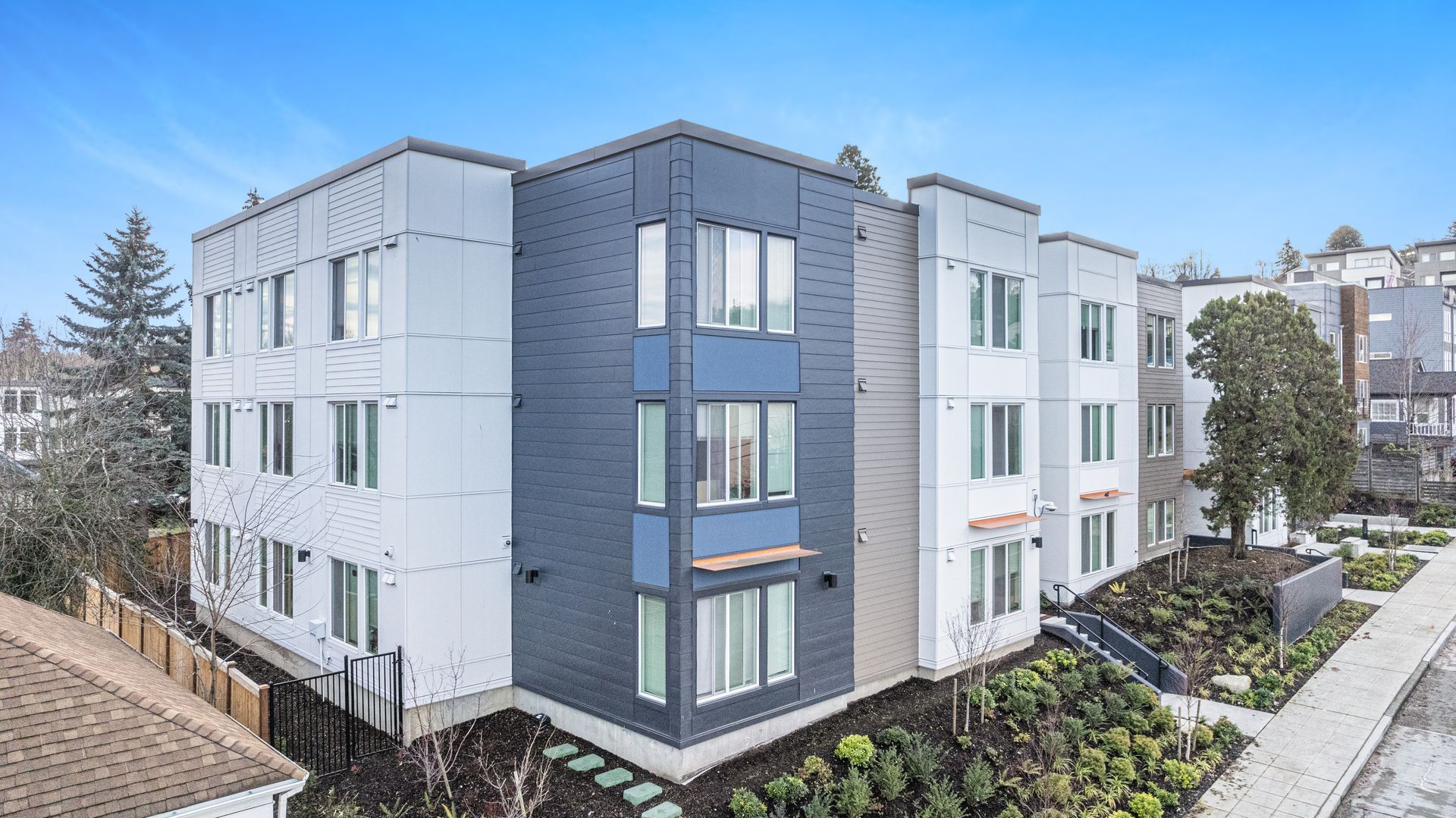 An aerial view of a large apartment building with a lot of windows.