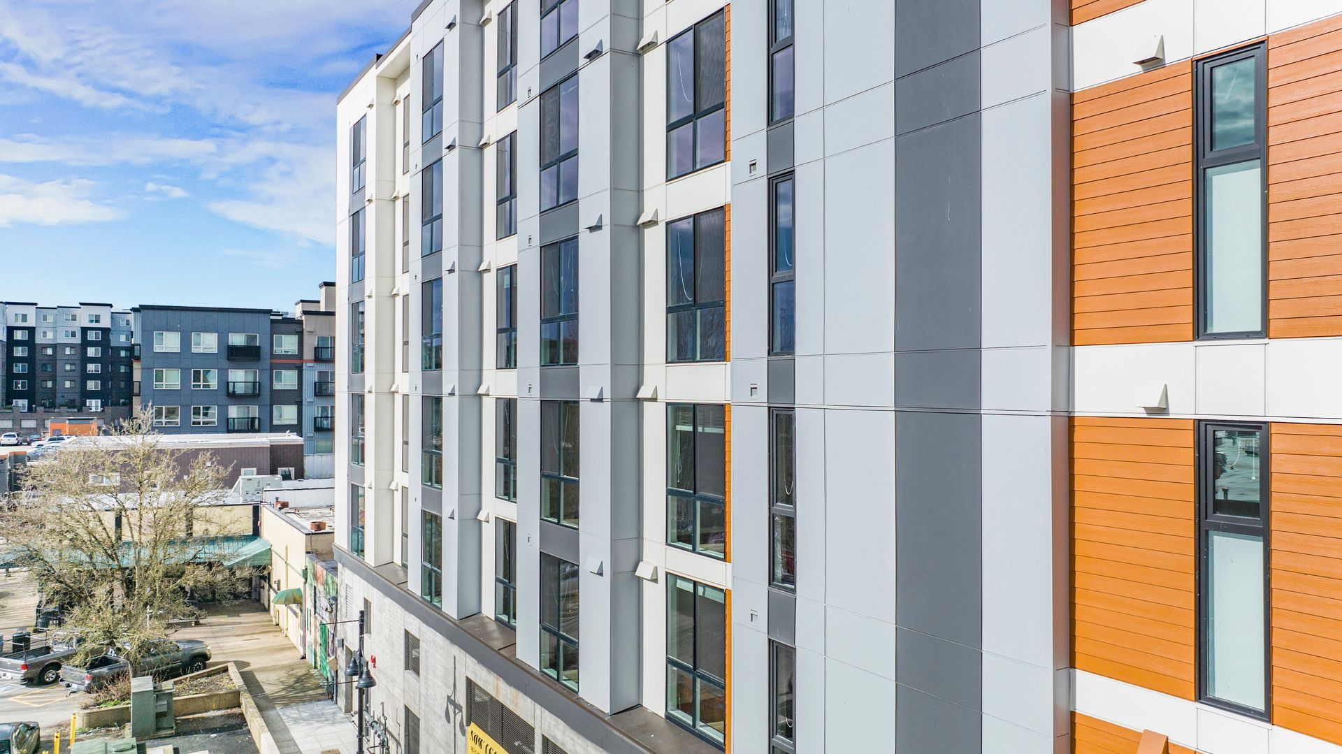 An aerial view of a large apartment building with a lot of windows.