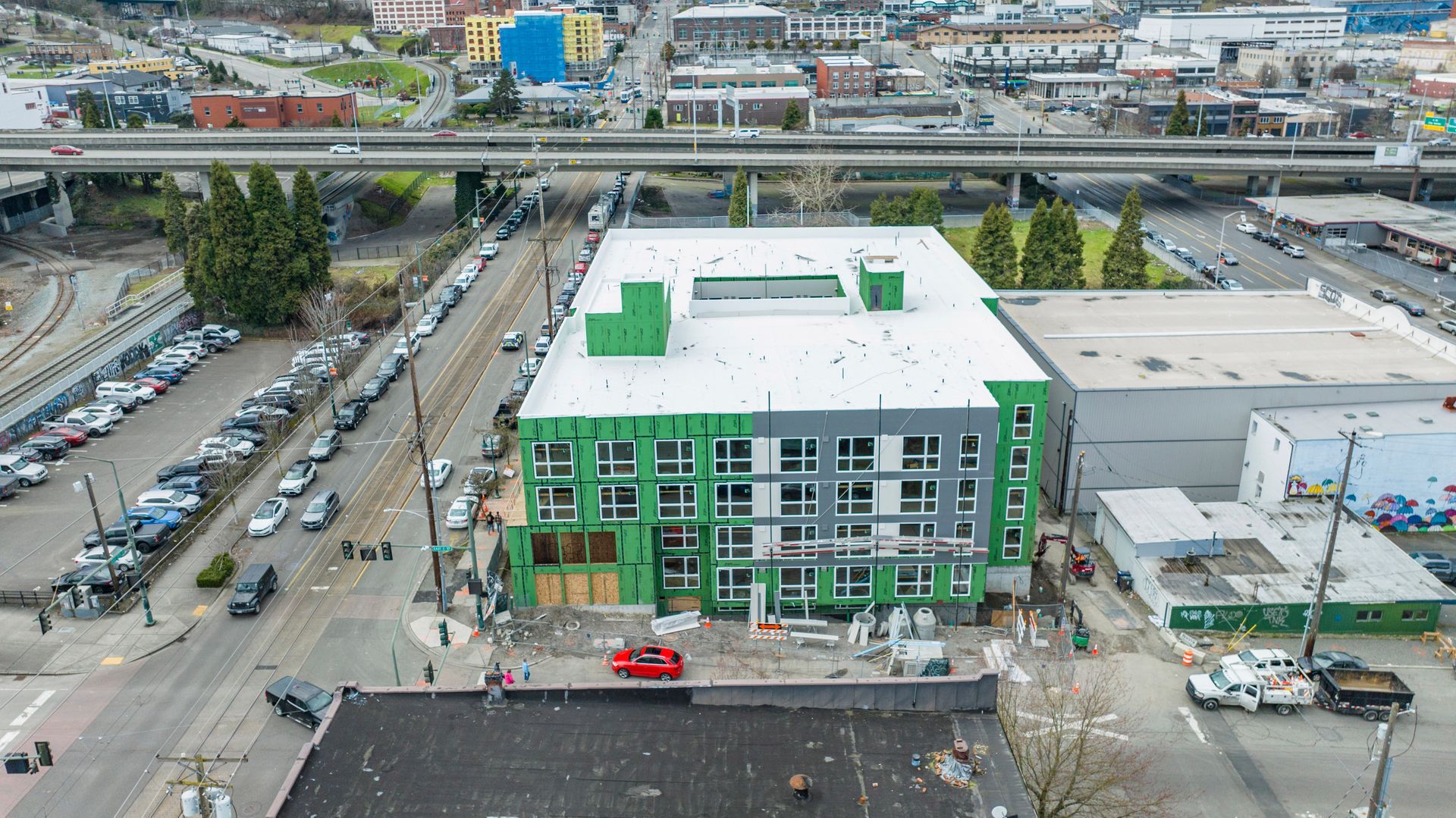 An aerial view of a building under construction in a city