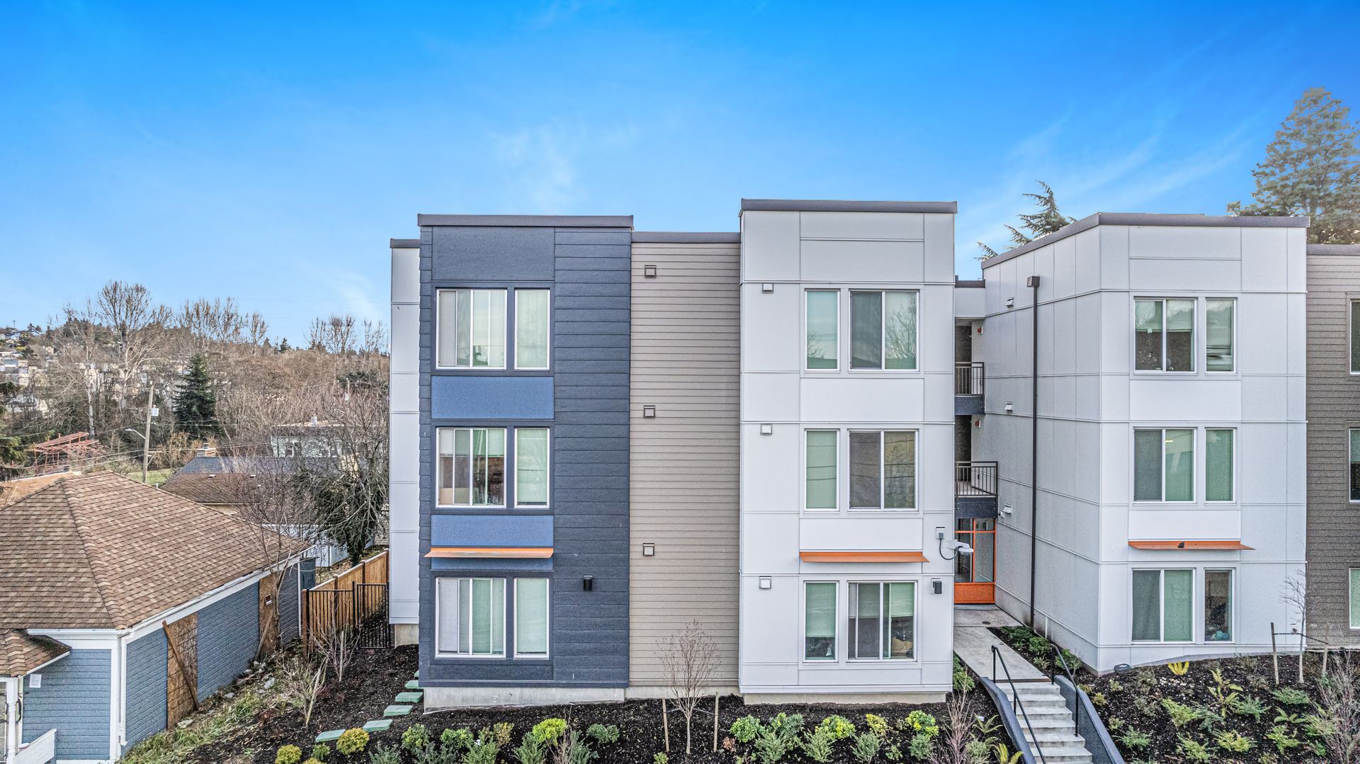An aerial view of a large apartment building with a lot of windows.