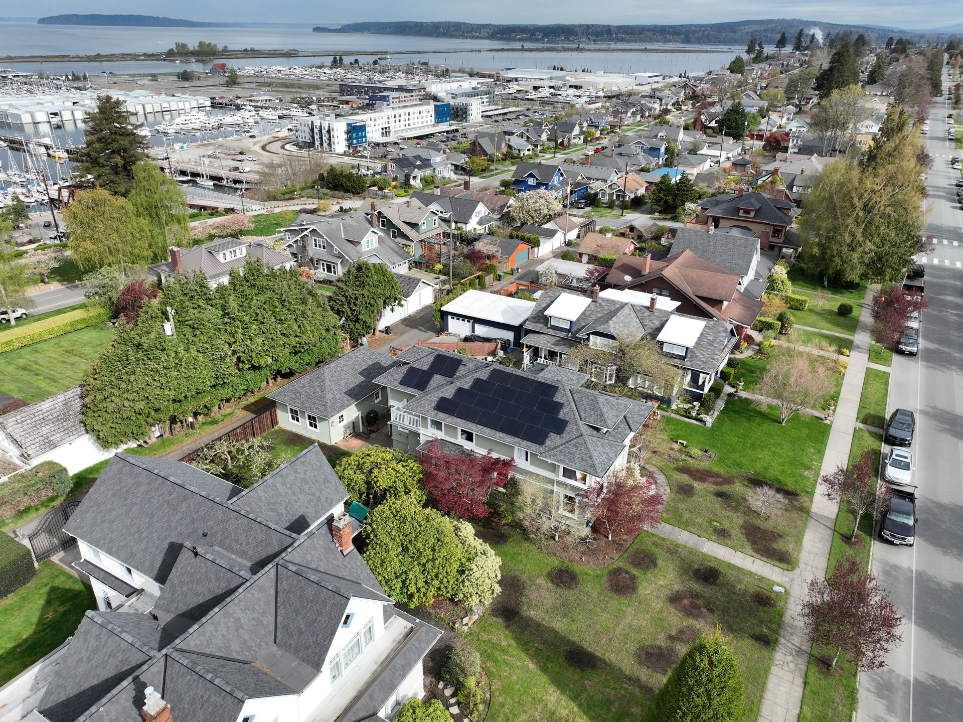 An aerial view of a residential area with a lot of houses and trees.
