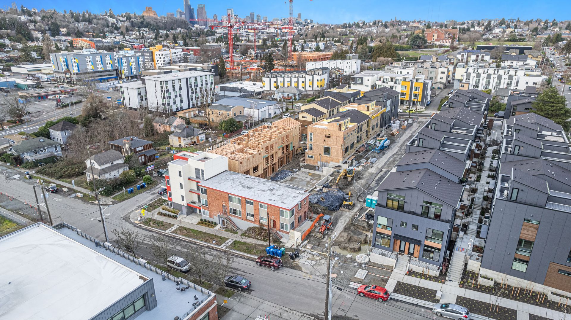 An aerial view of a building under construction in a city.